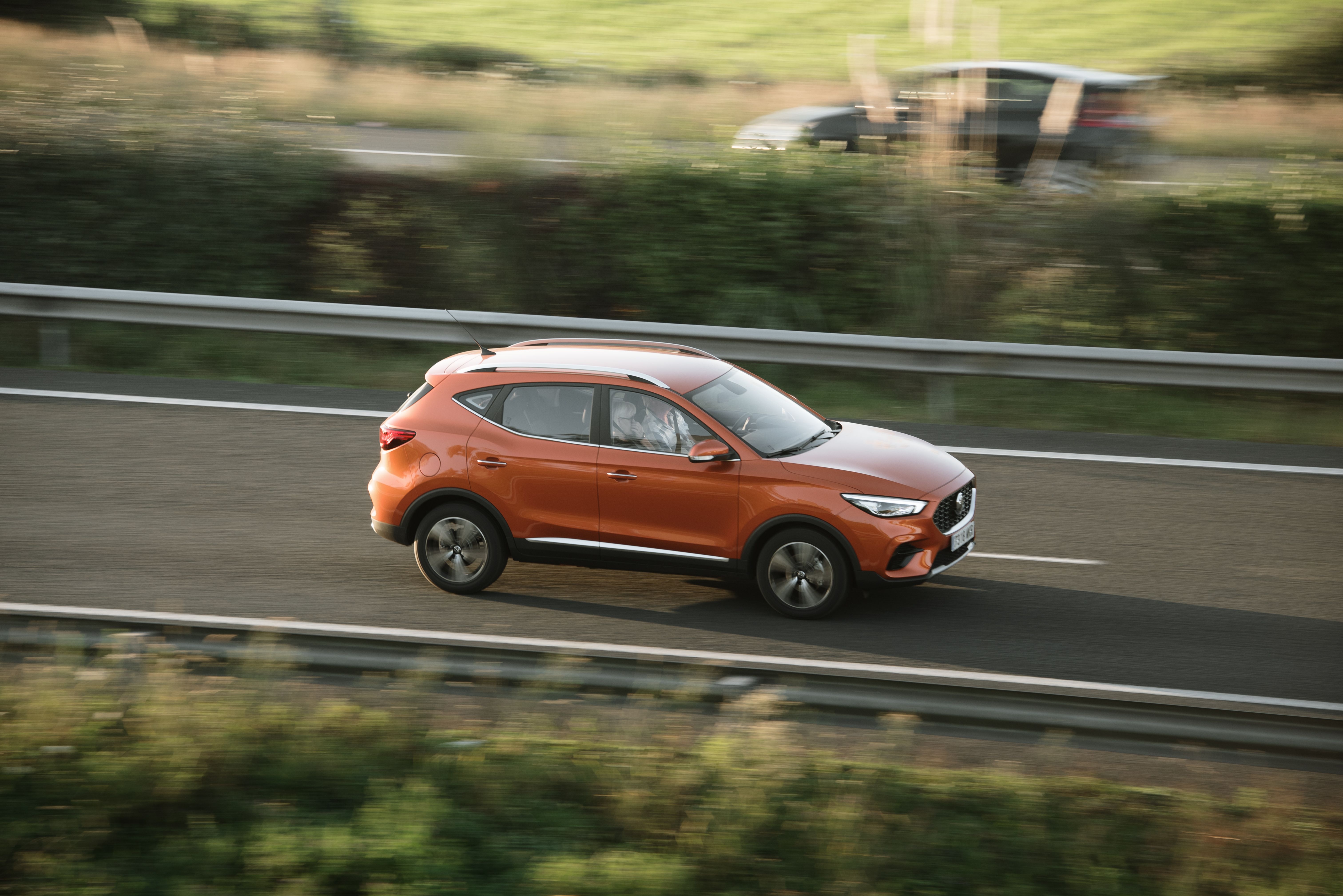 orange car on the road