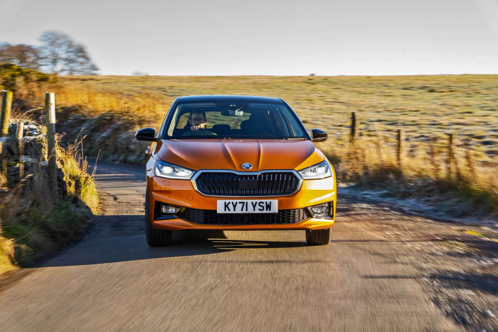 Orange Skoda Fabia driving
