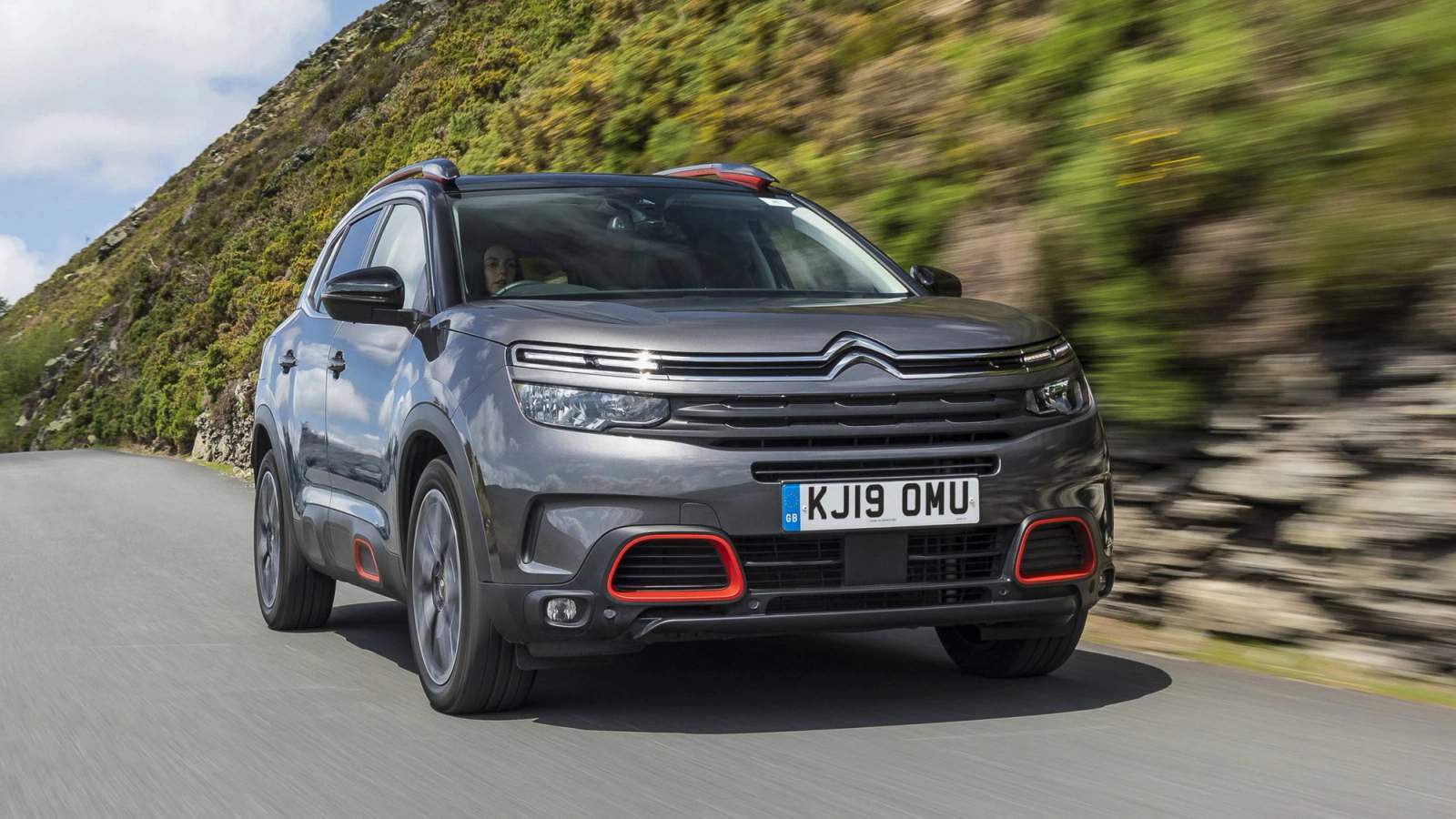 Grey Citroen C5 Aircross driving in the countryside