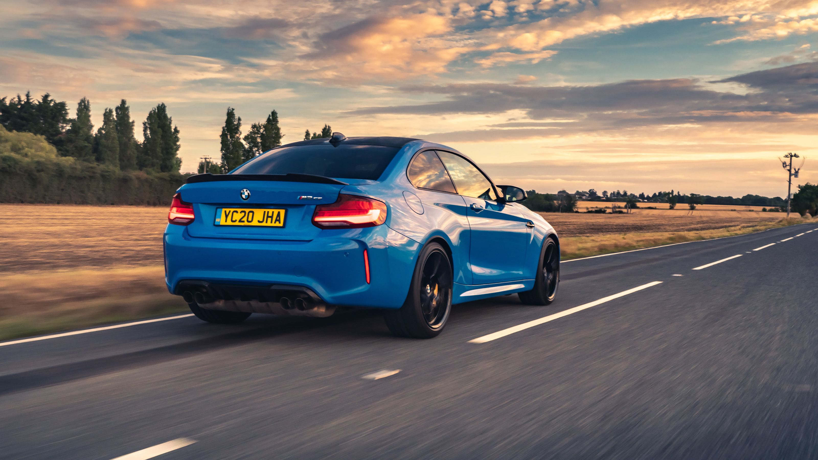 Blue BMW M2 CS rear driving