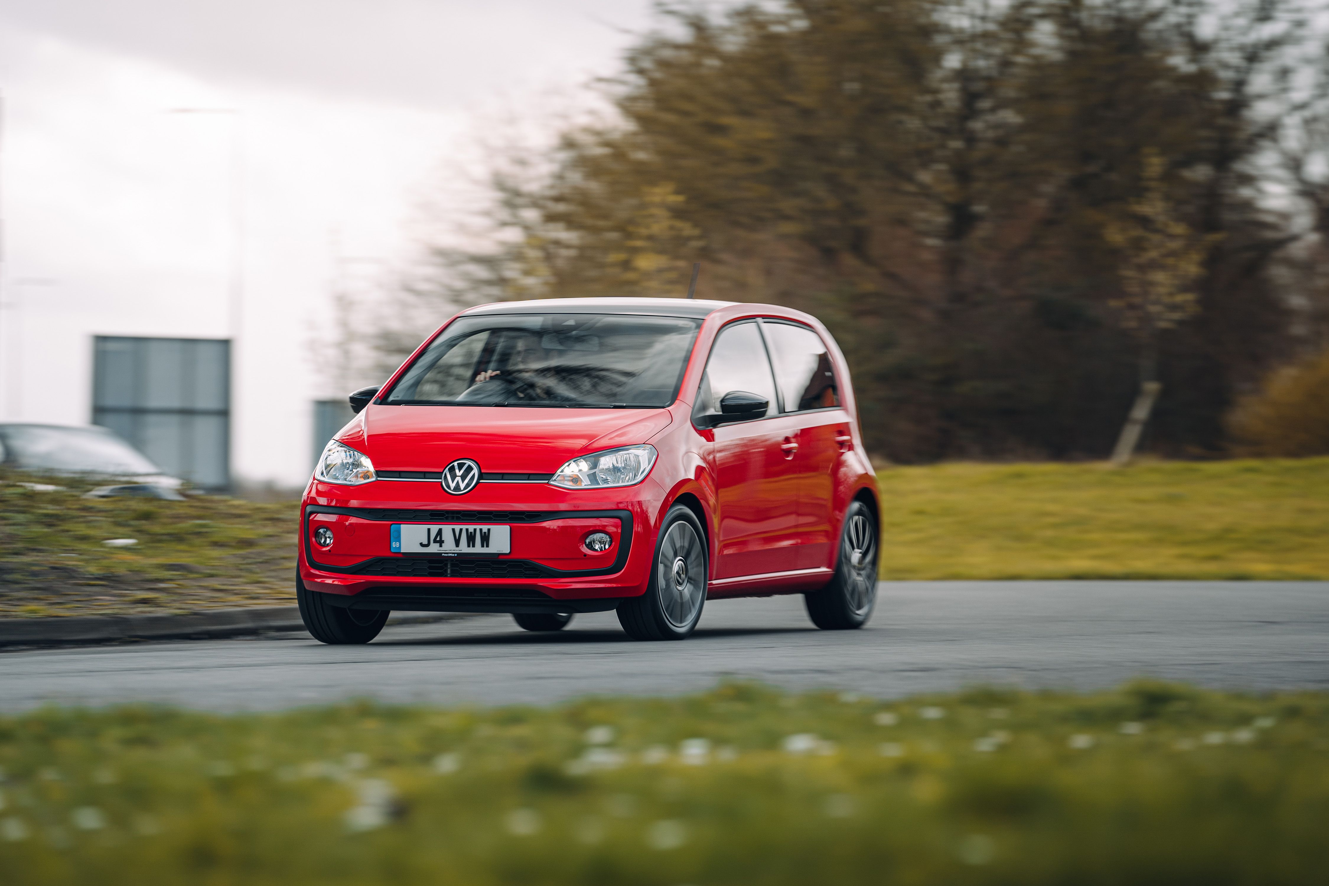 Red Volkswagen Up! driving