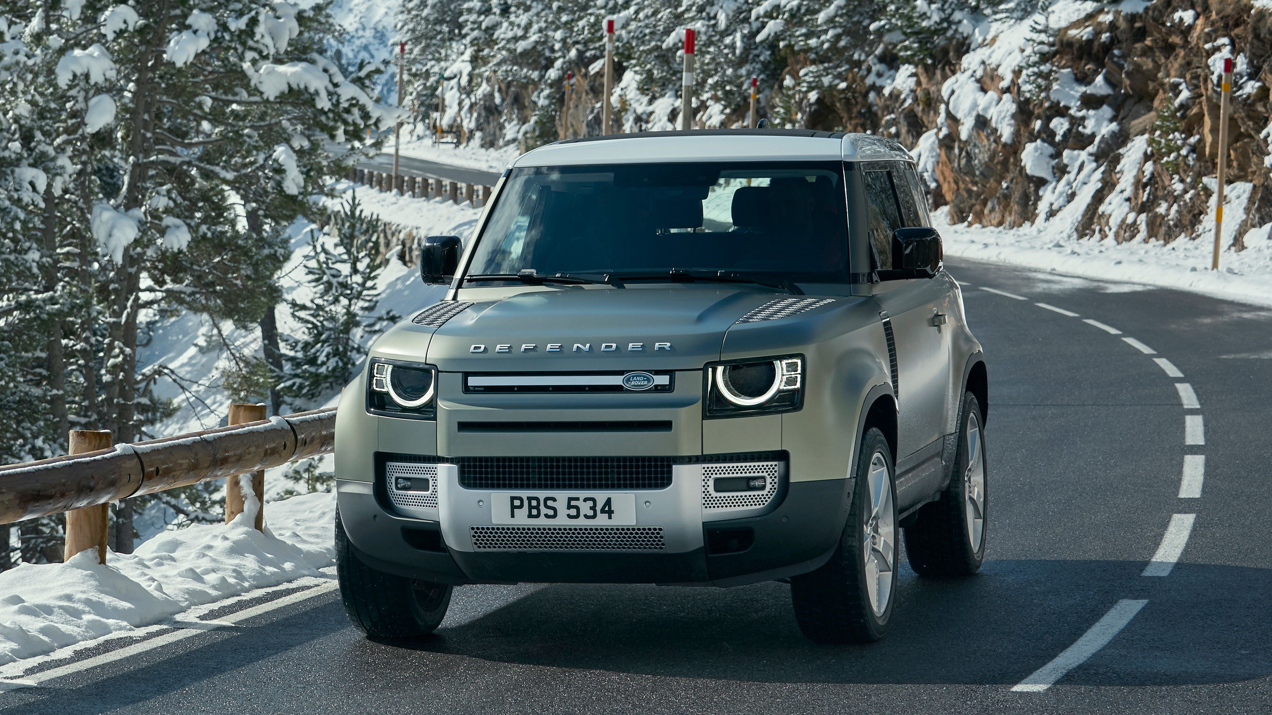 Land Rover Defender driving in snow