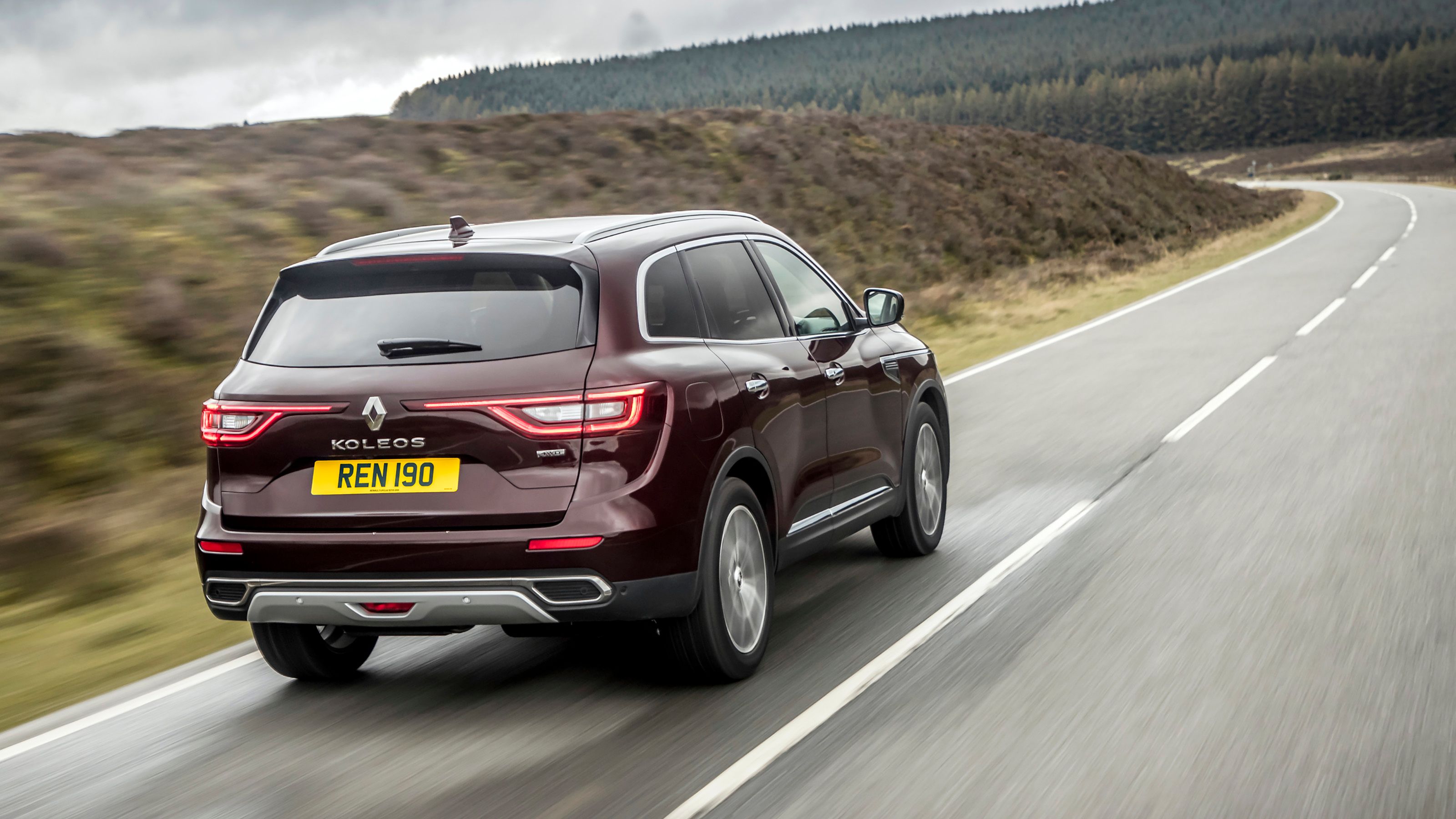Maroon Renault Koleos rear driving