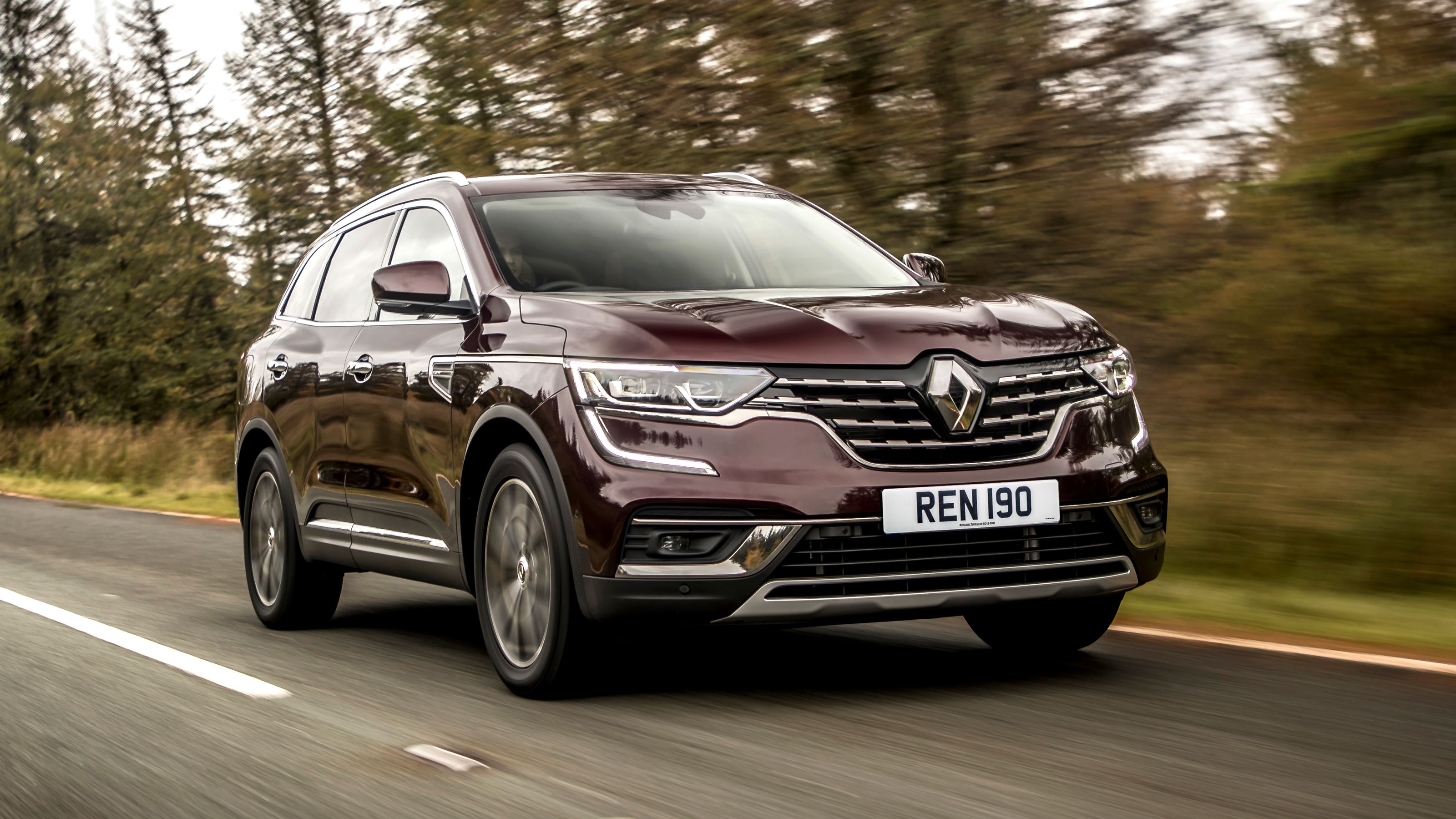 Maroon Renault Koleos front driving