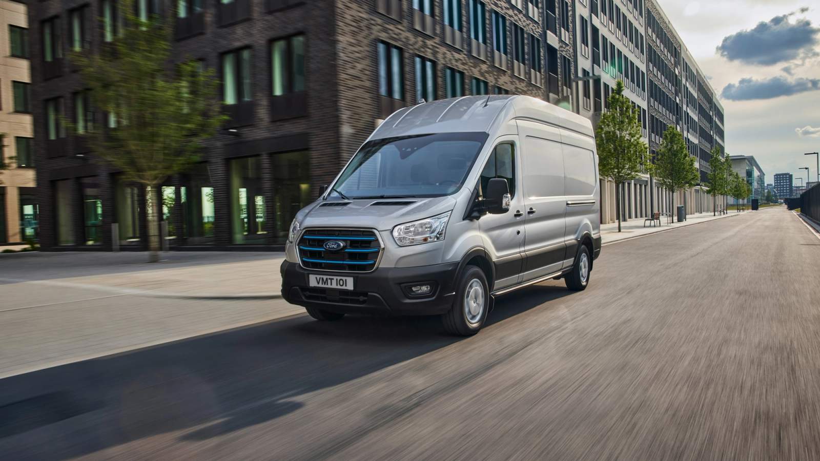 Silver Ford E-Transit driving 