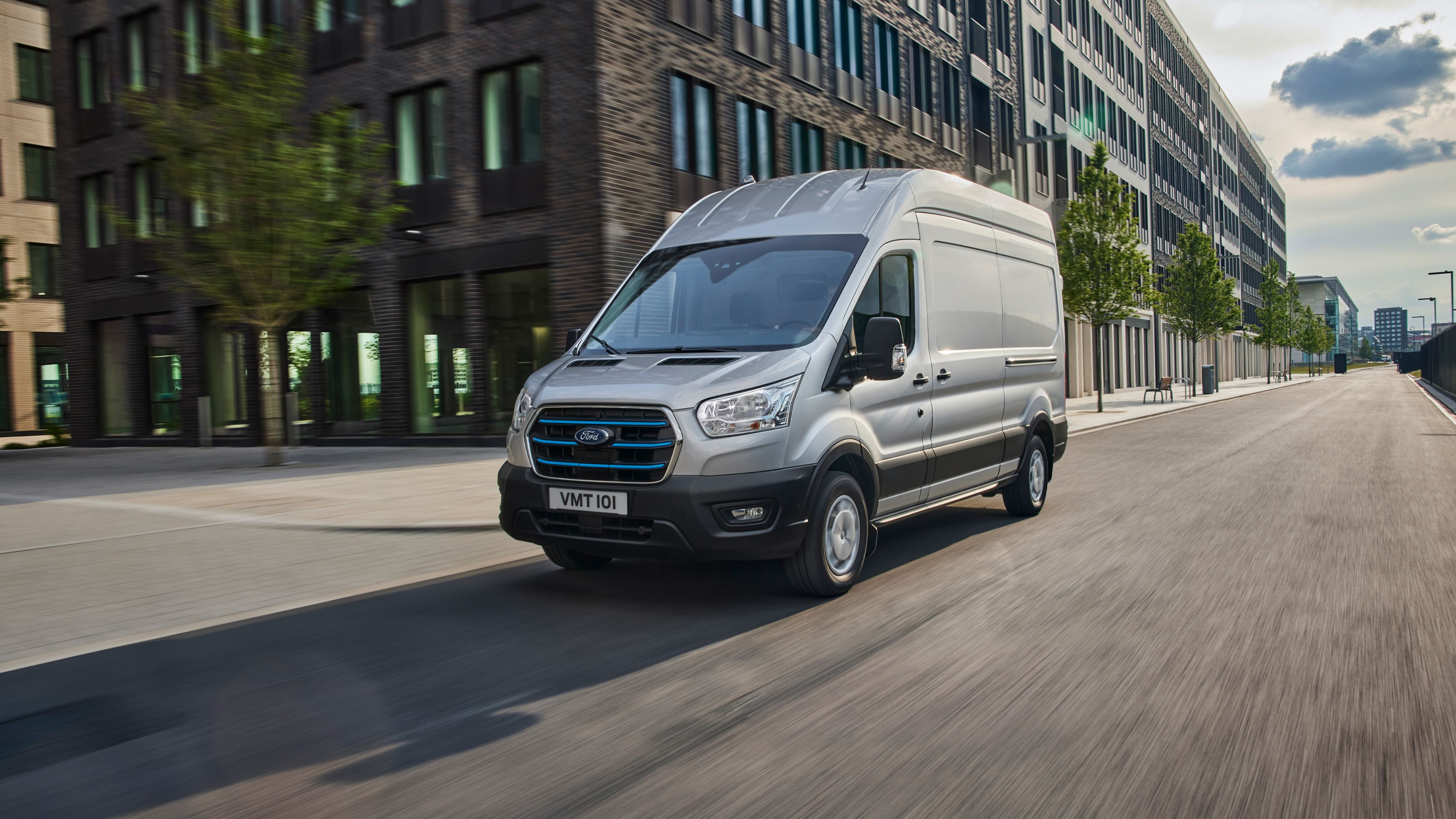 Silver Ford E-Transit driving