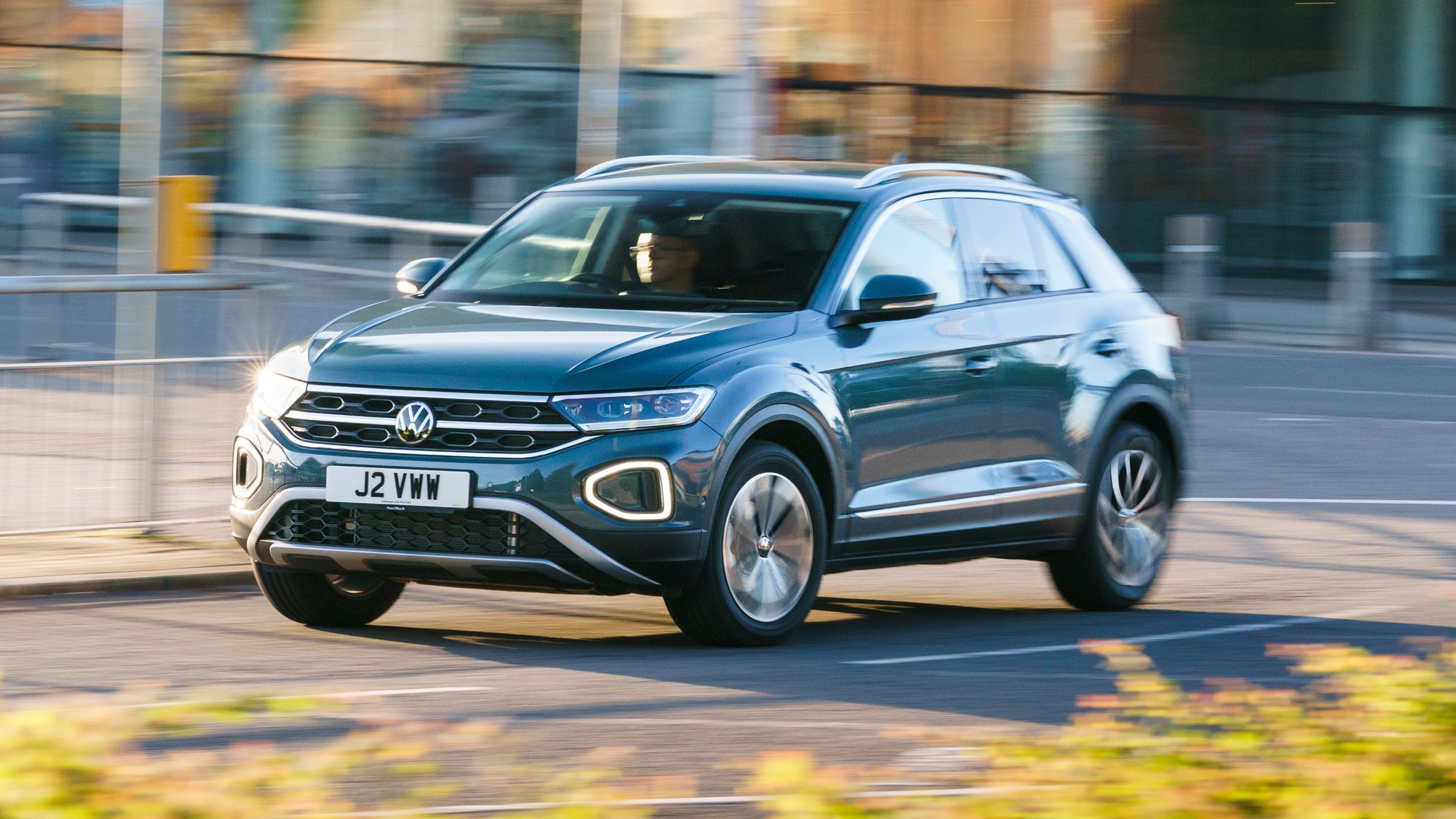 Blue Volkswagen T-Roc front driving