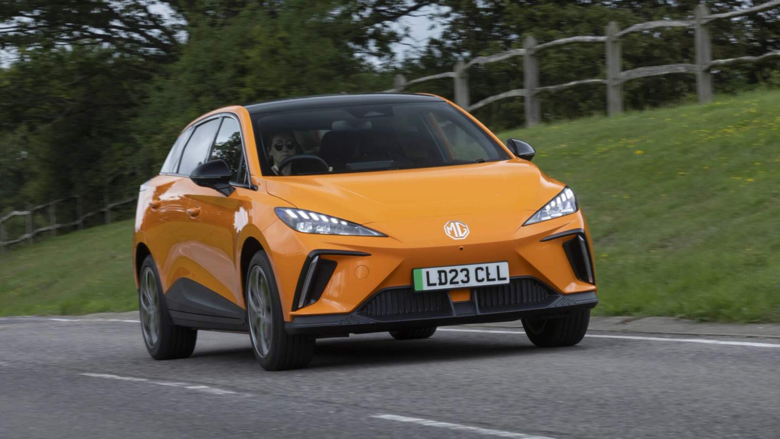 Orange MG4 driving
