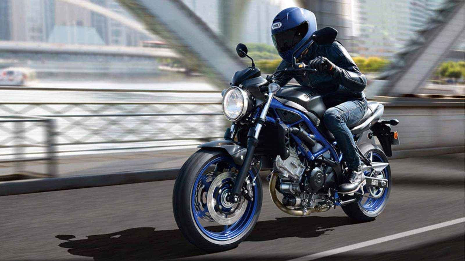 Suzuki SV650 being ridden across a bridge
