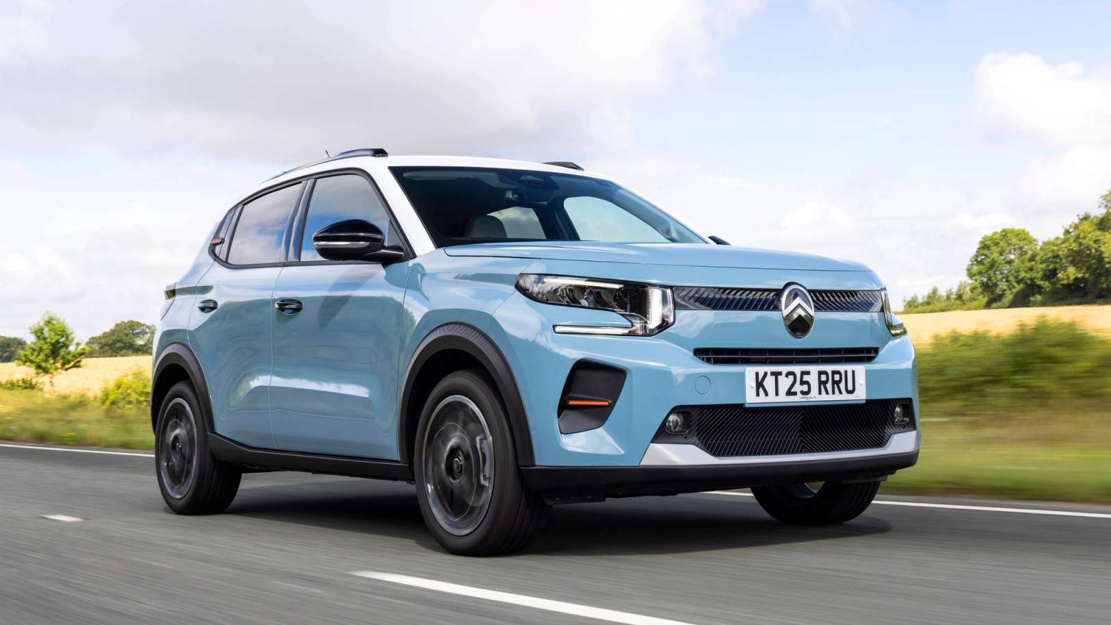 Blue Citroen C3 driving