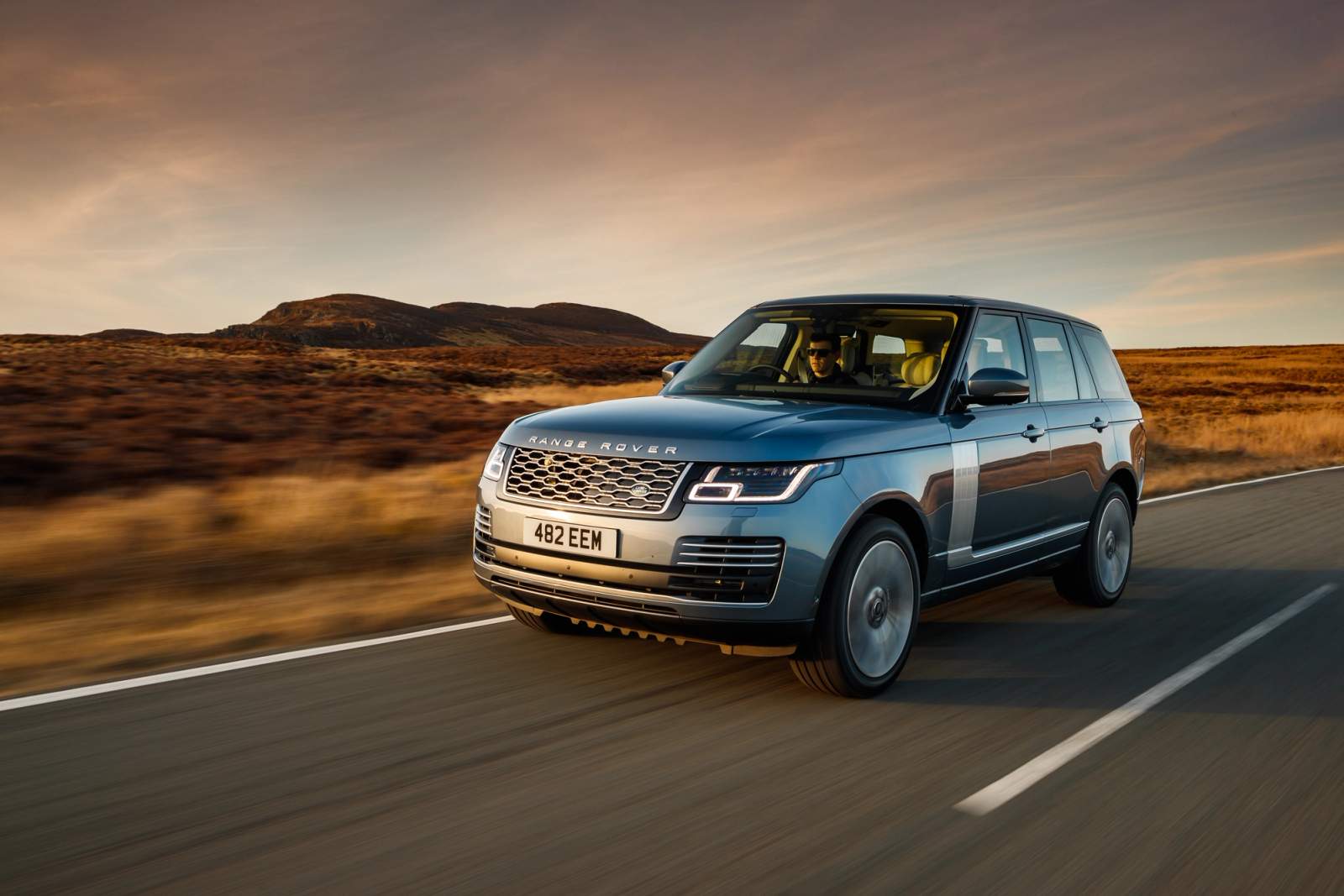 Blue Range Rover driving