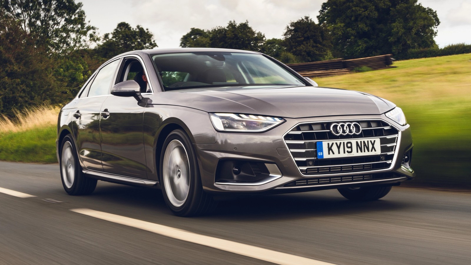 Brown Audi A4 front driving