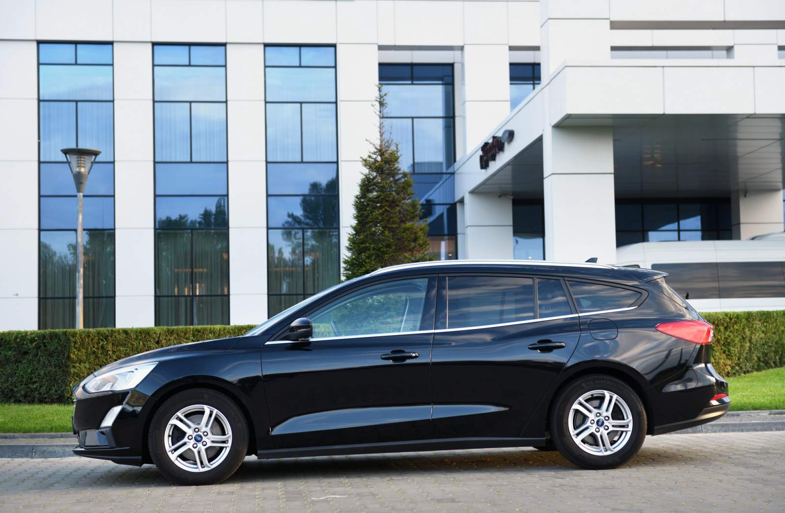 black car parked in front of building