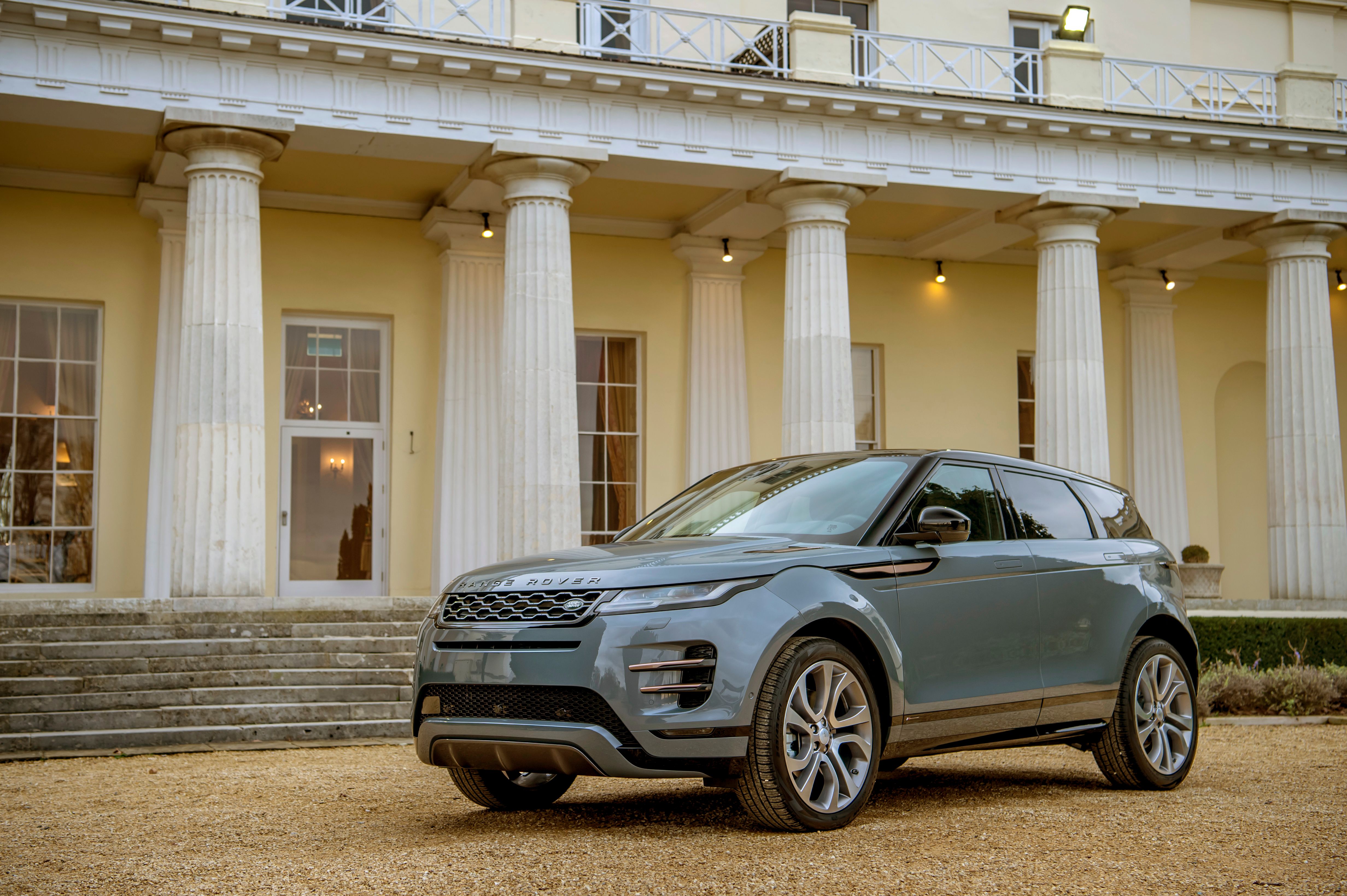 blue car outside house 
