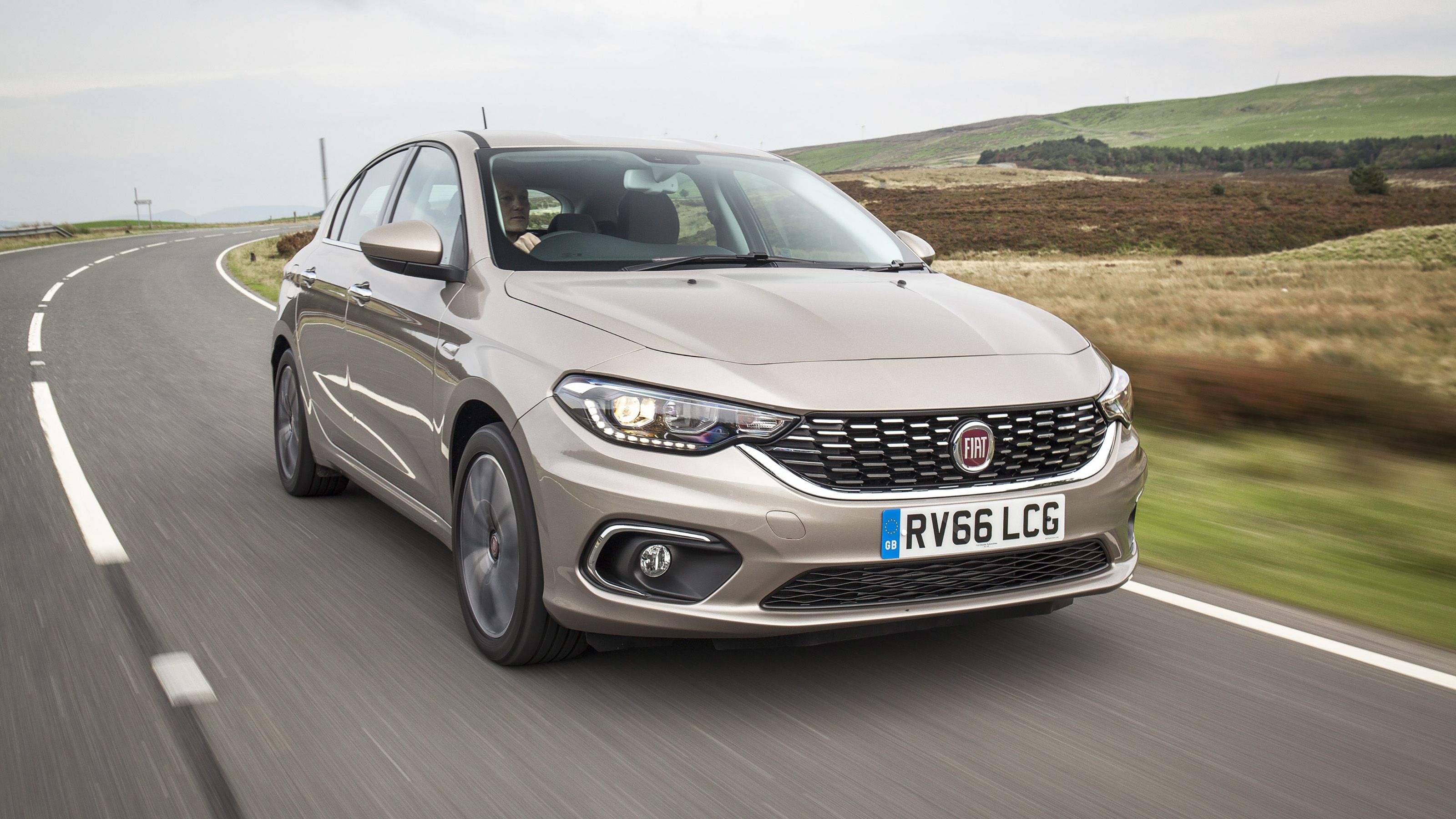 Beige Fiat Tipo front driving