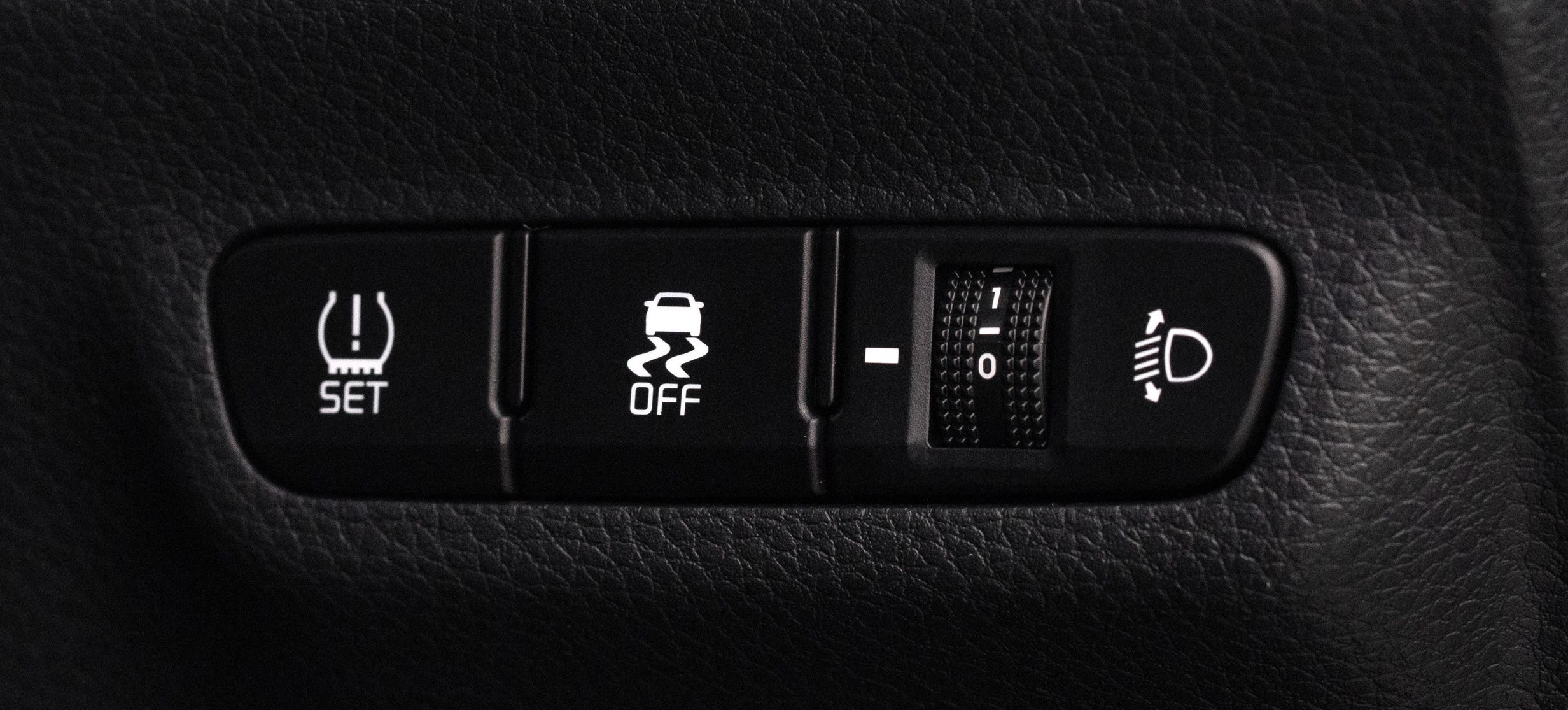 Vehicle traction control button