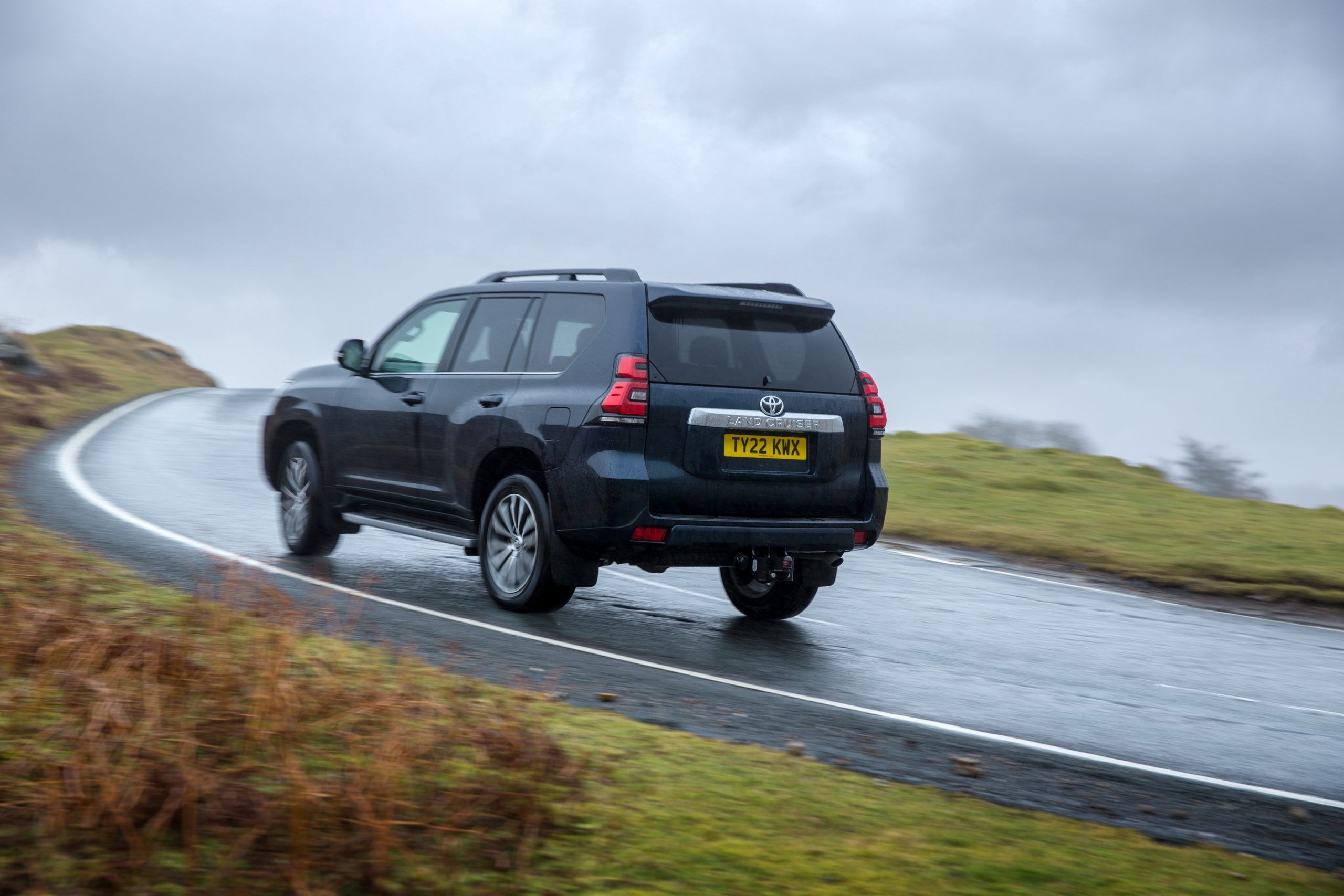 Blue Toyota Land Cruiser driving