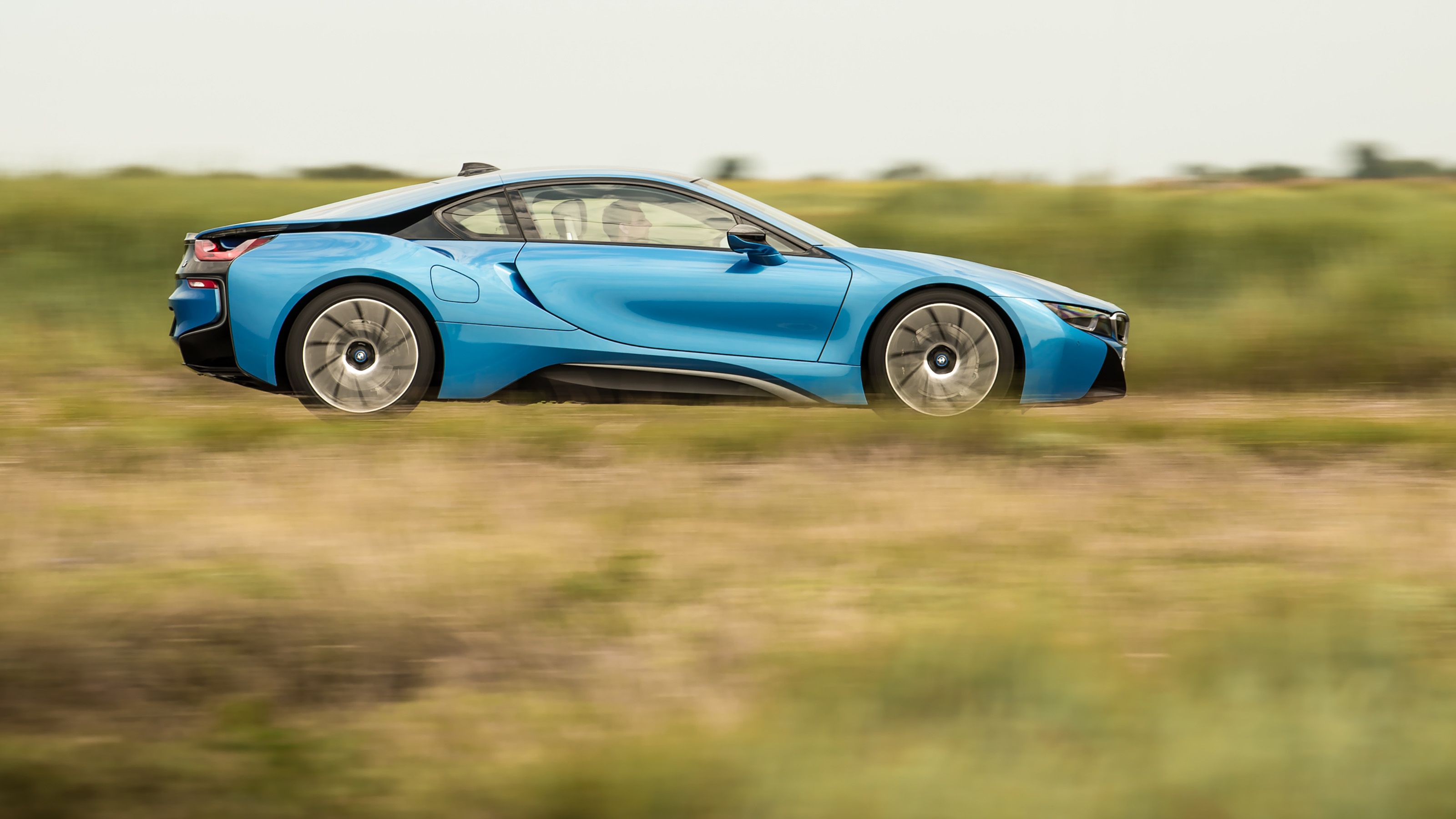 Blue BMW i8 side driving