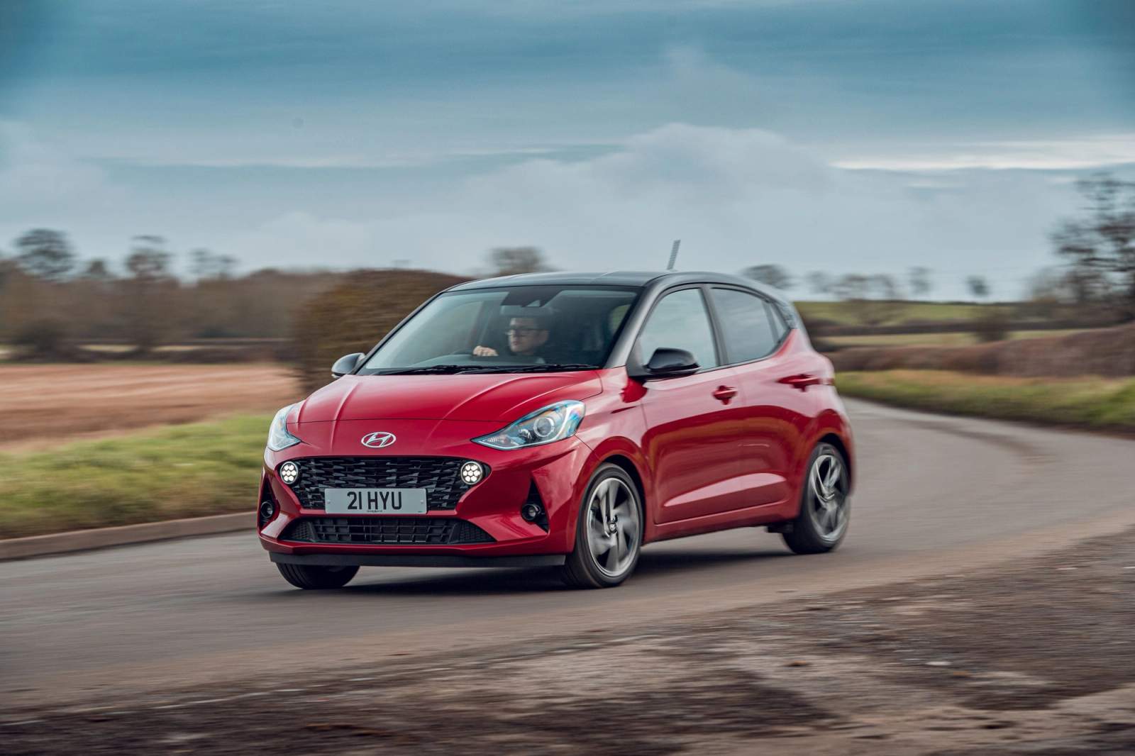 Red Hyundai i10 driving