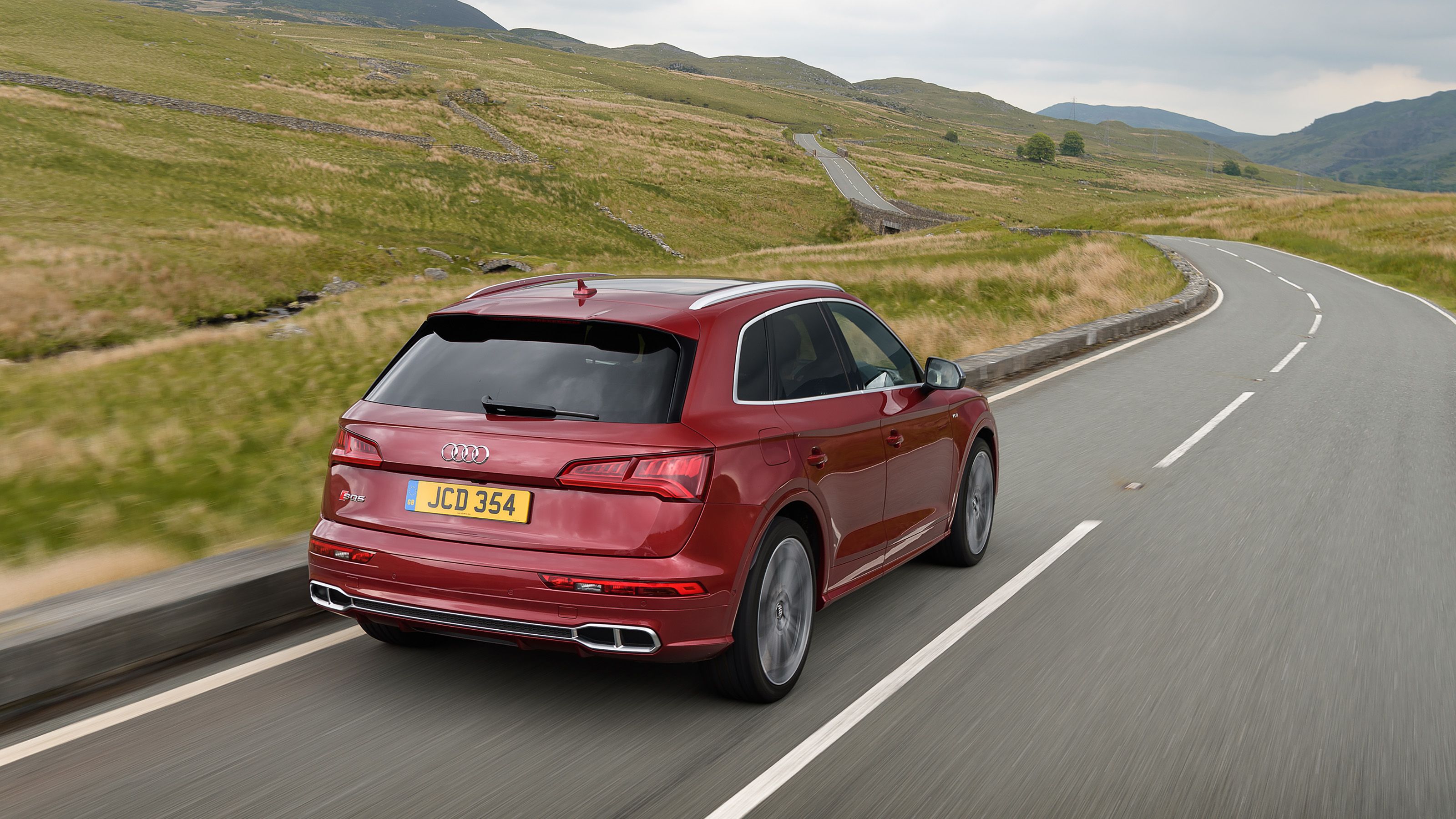 Red Audi SQ5 rear driving