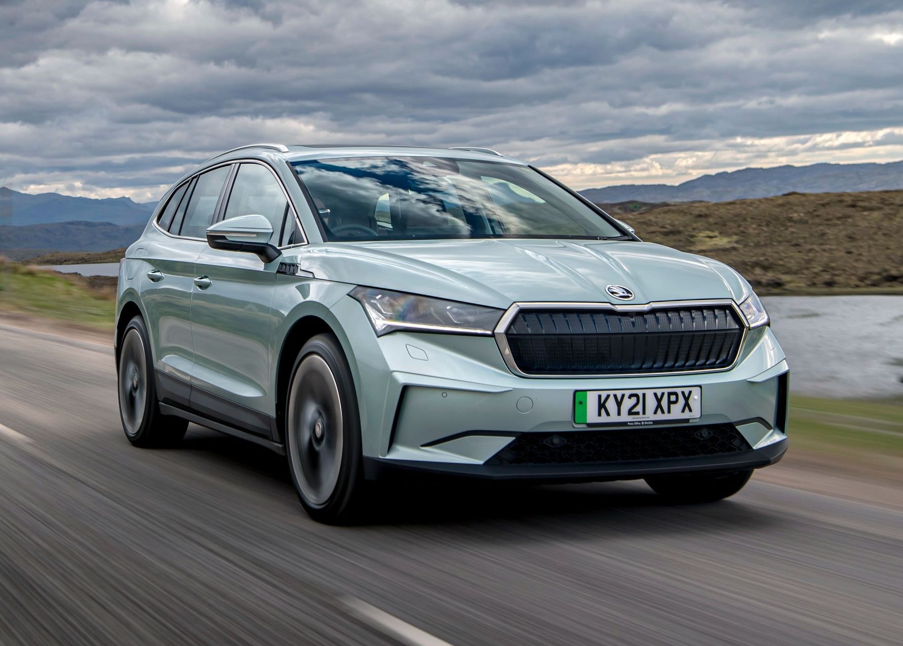 Green Skoda Enyaq driving