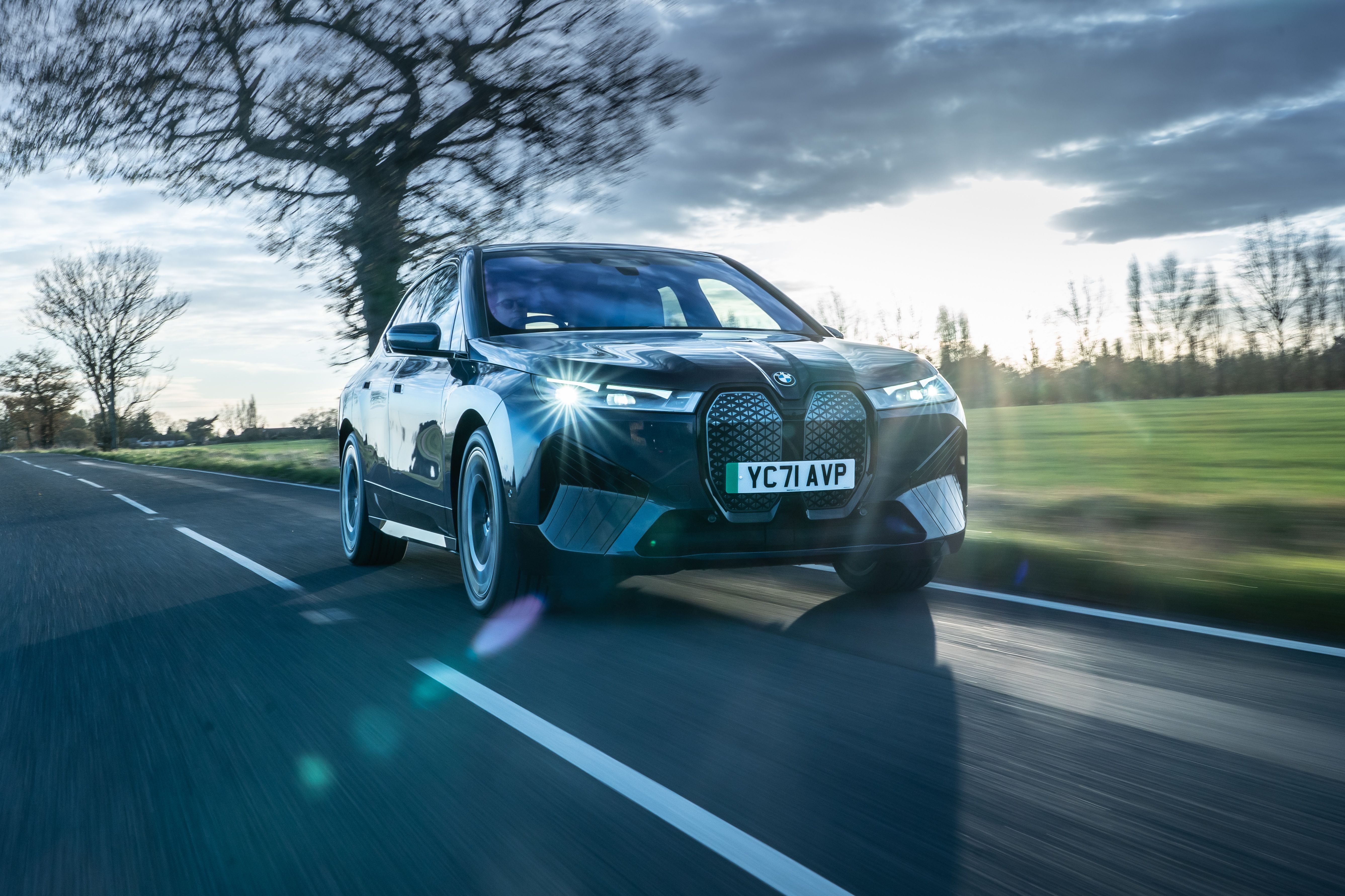 Black BMW iX driving