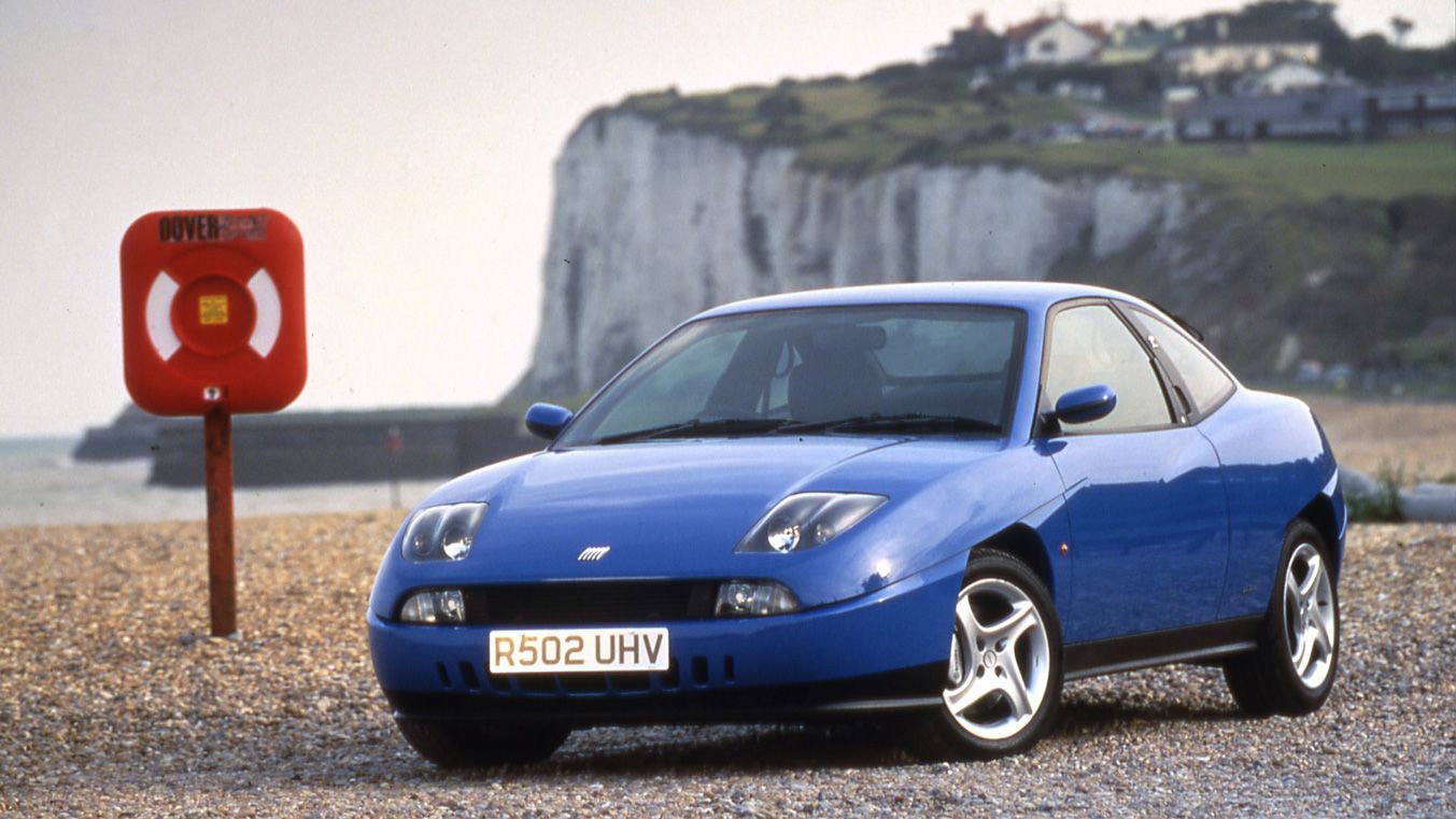 Blue Fiat Coupe 20v Turbo parked on a beach
