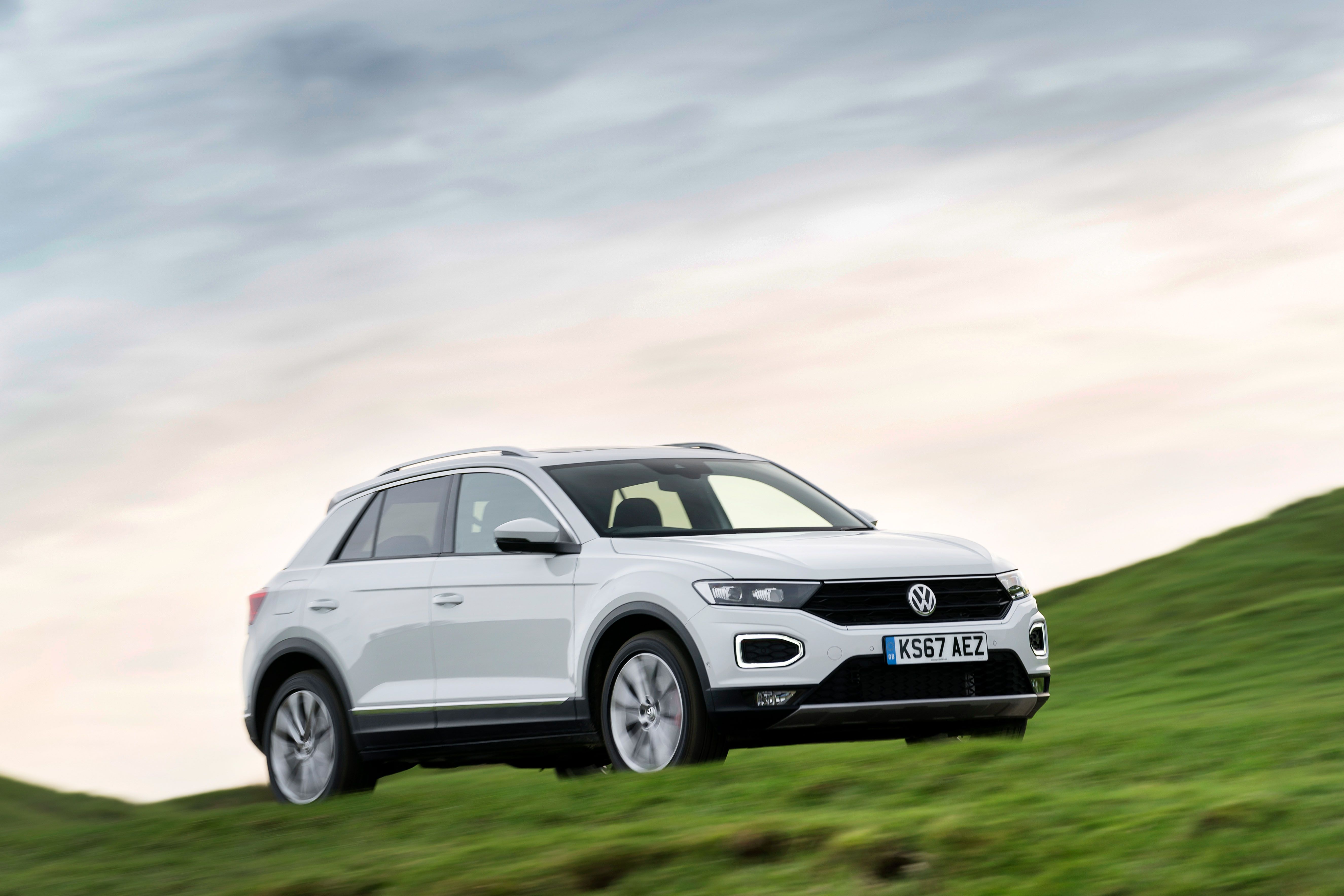 White Volkswagen T-Roc driving