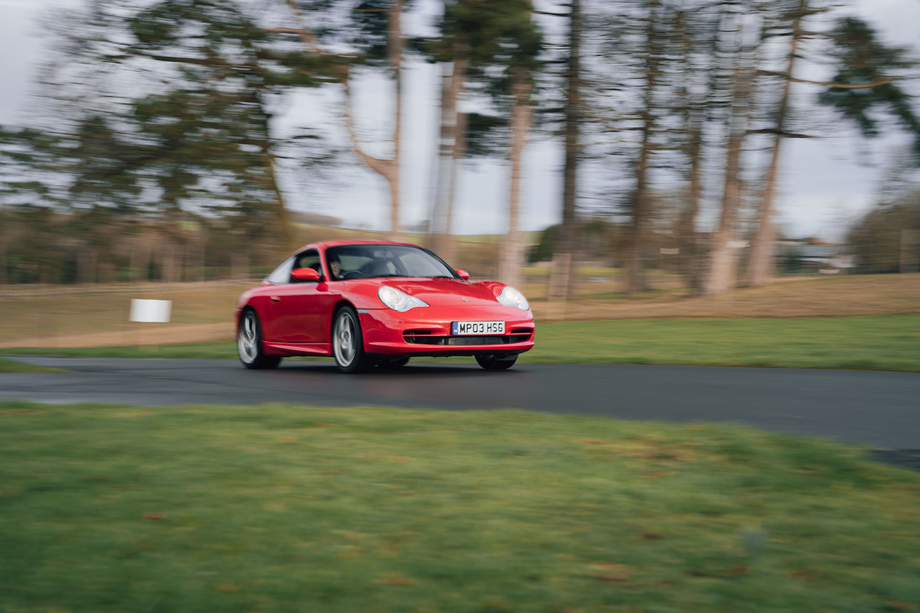 Red Porsche 911 driving