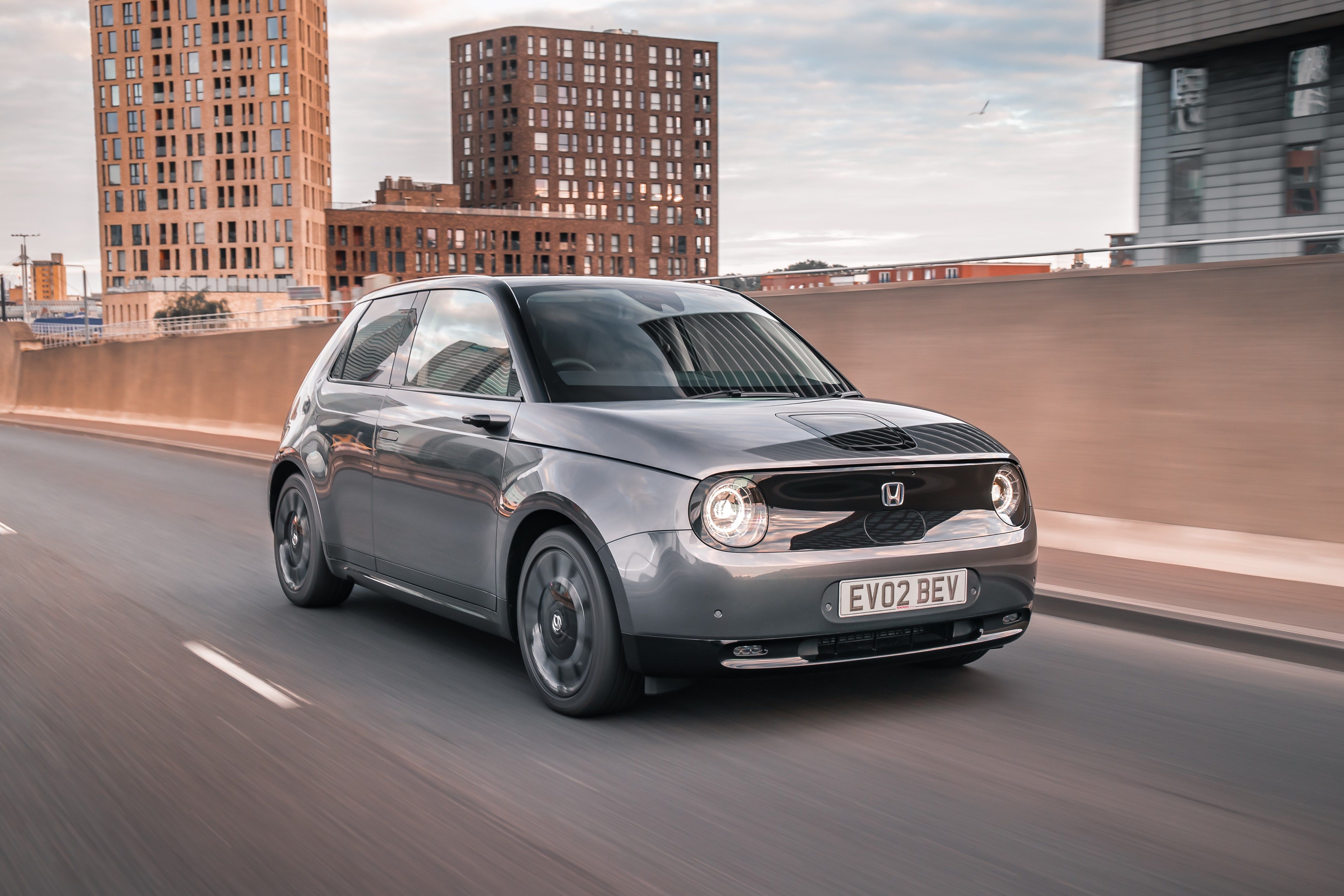 Grey Honda E driving