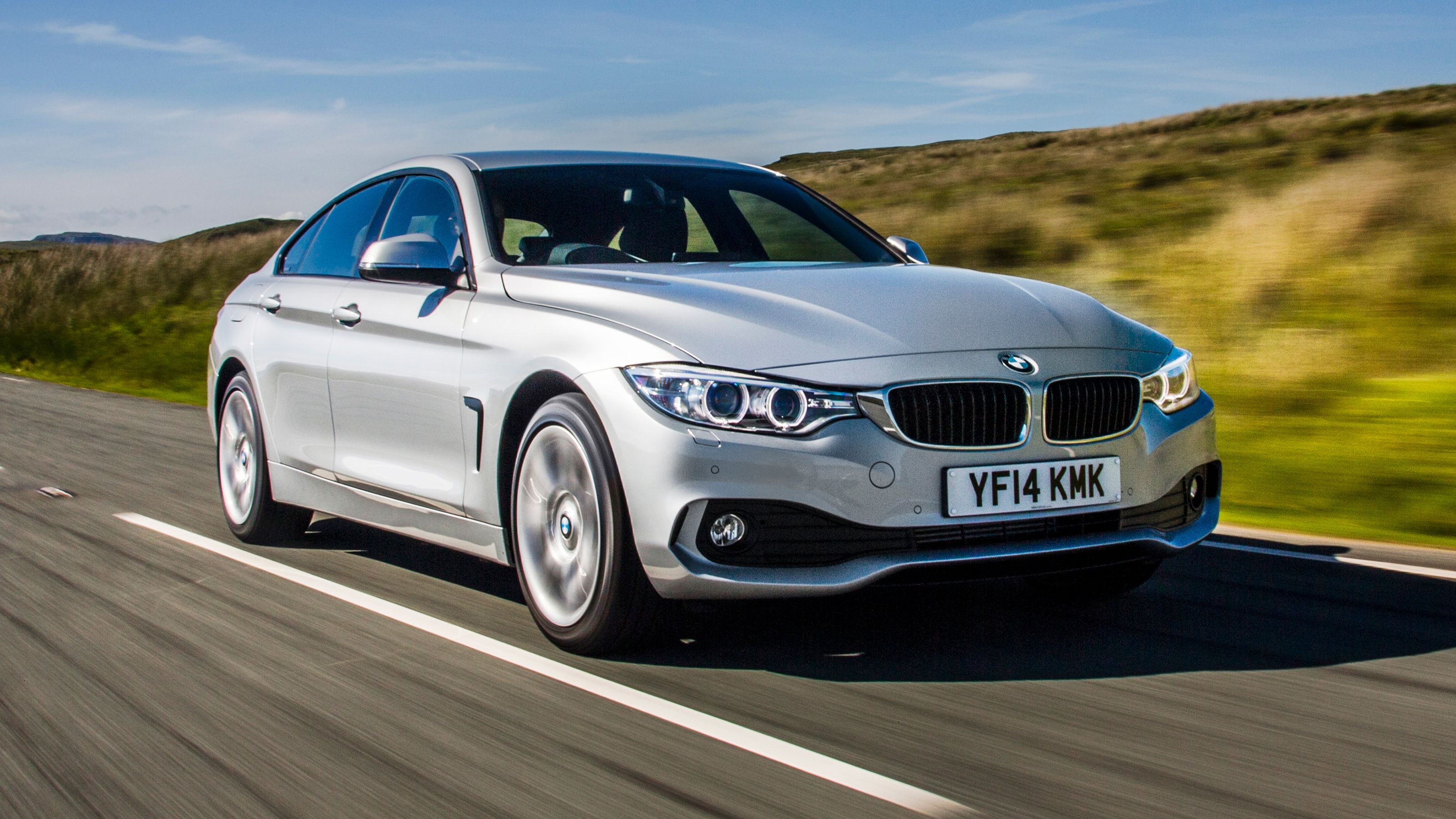 Silver BMW 4 Series Gran Coupe front driving