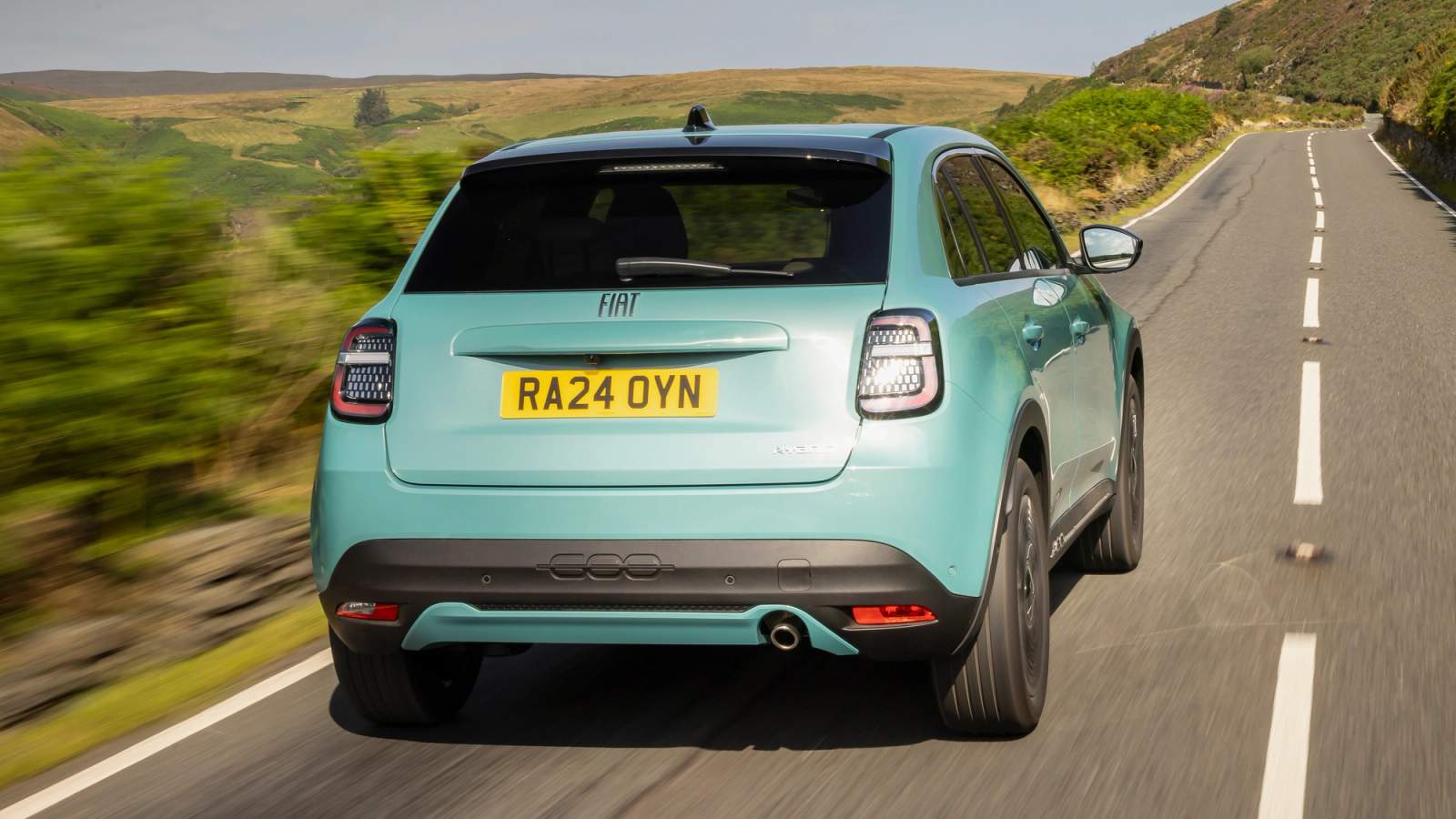 Fiat 600 cruising along a country road