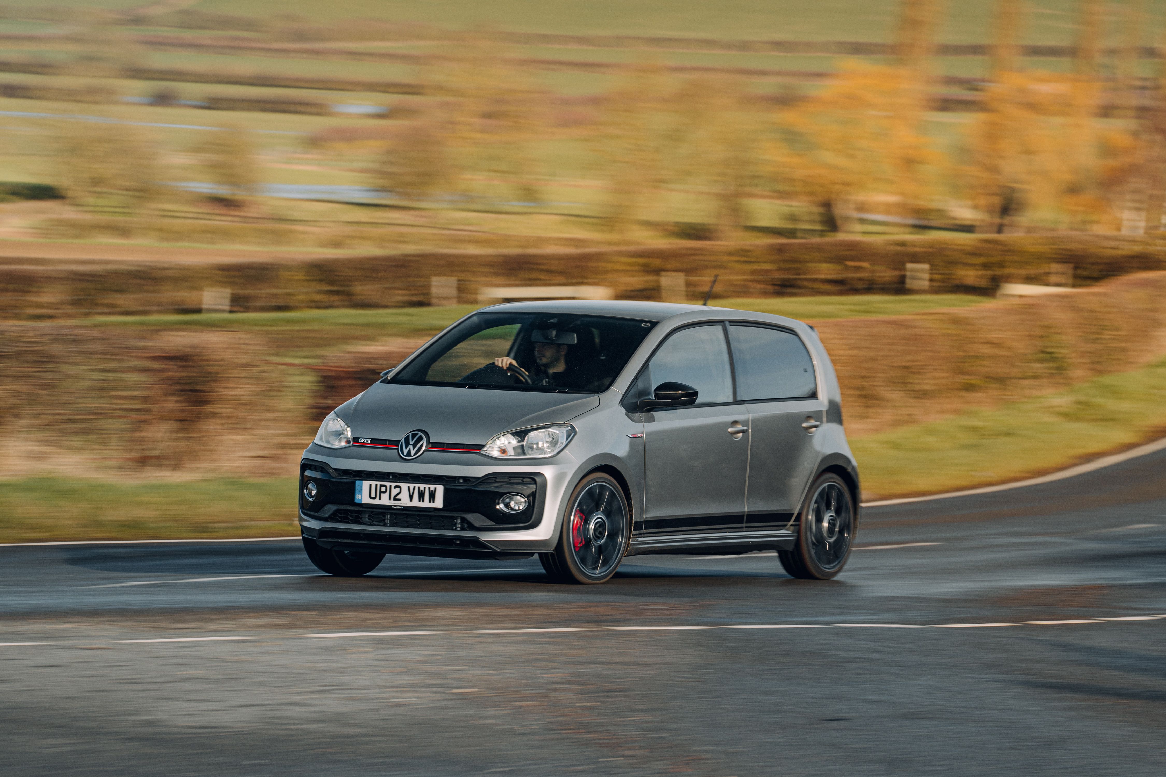 Grey Volkswagen Up! GTI driving