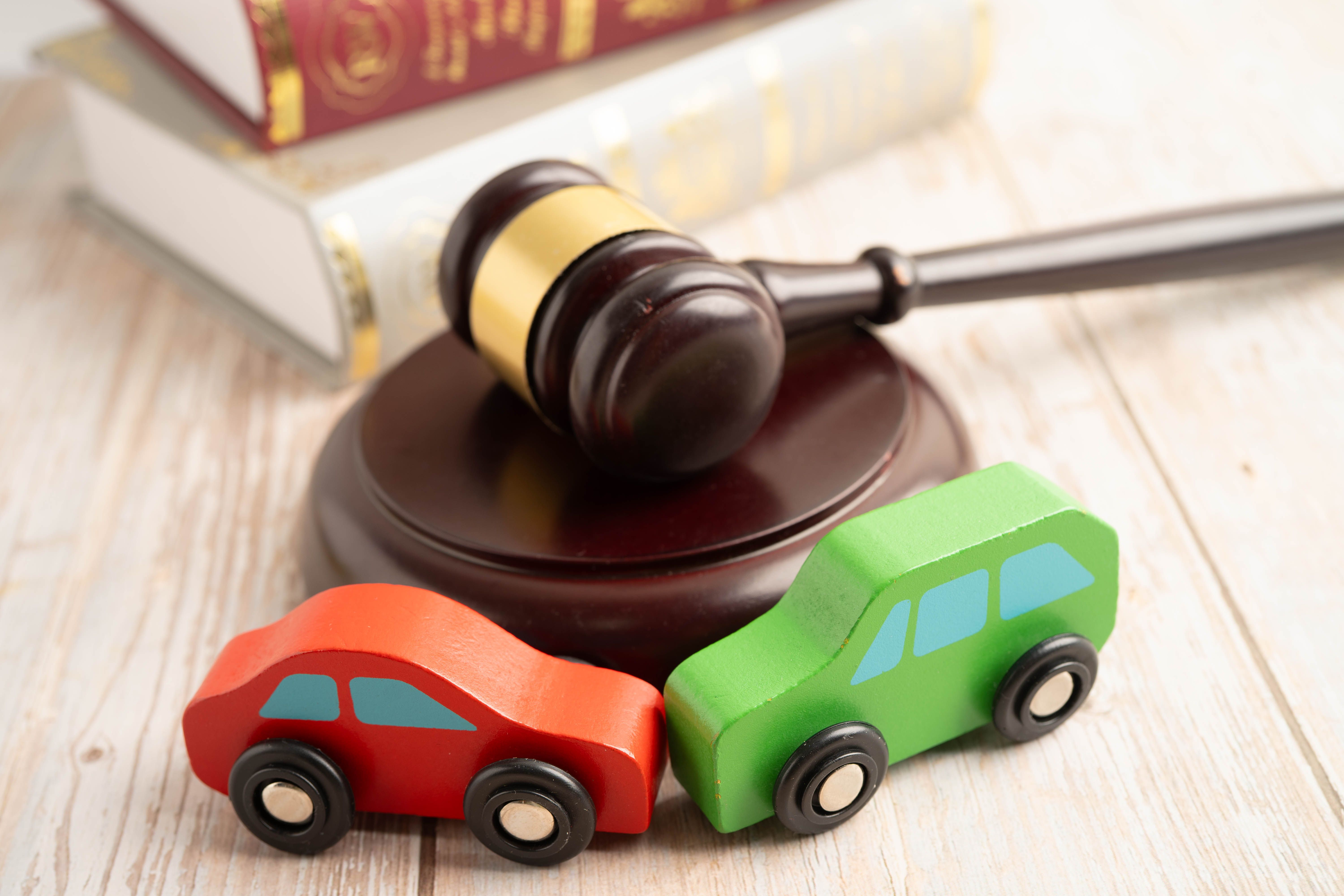 Hammer and gavel with miniature cars