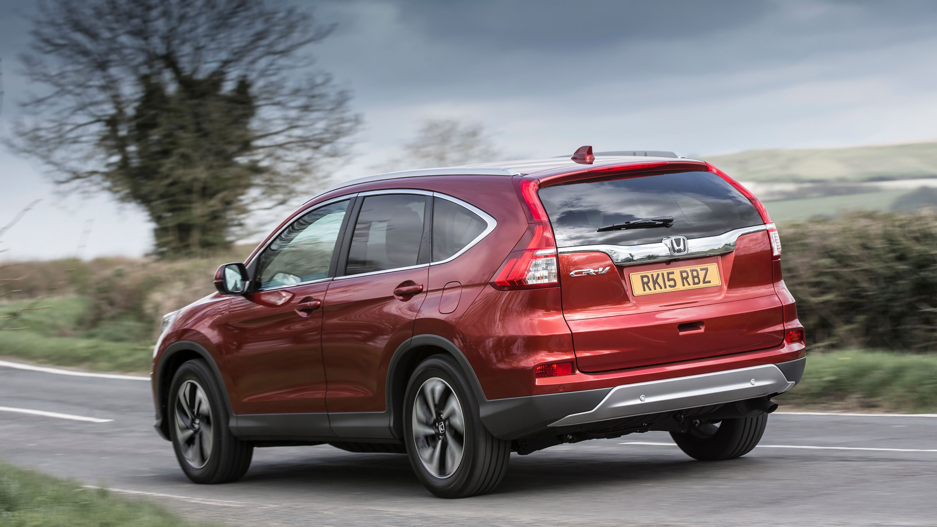 Red Honda CR-V rear driving