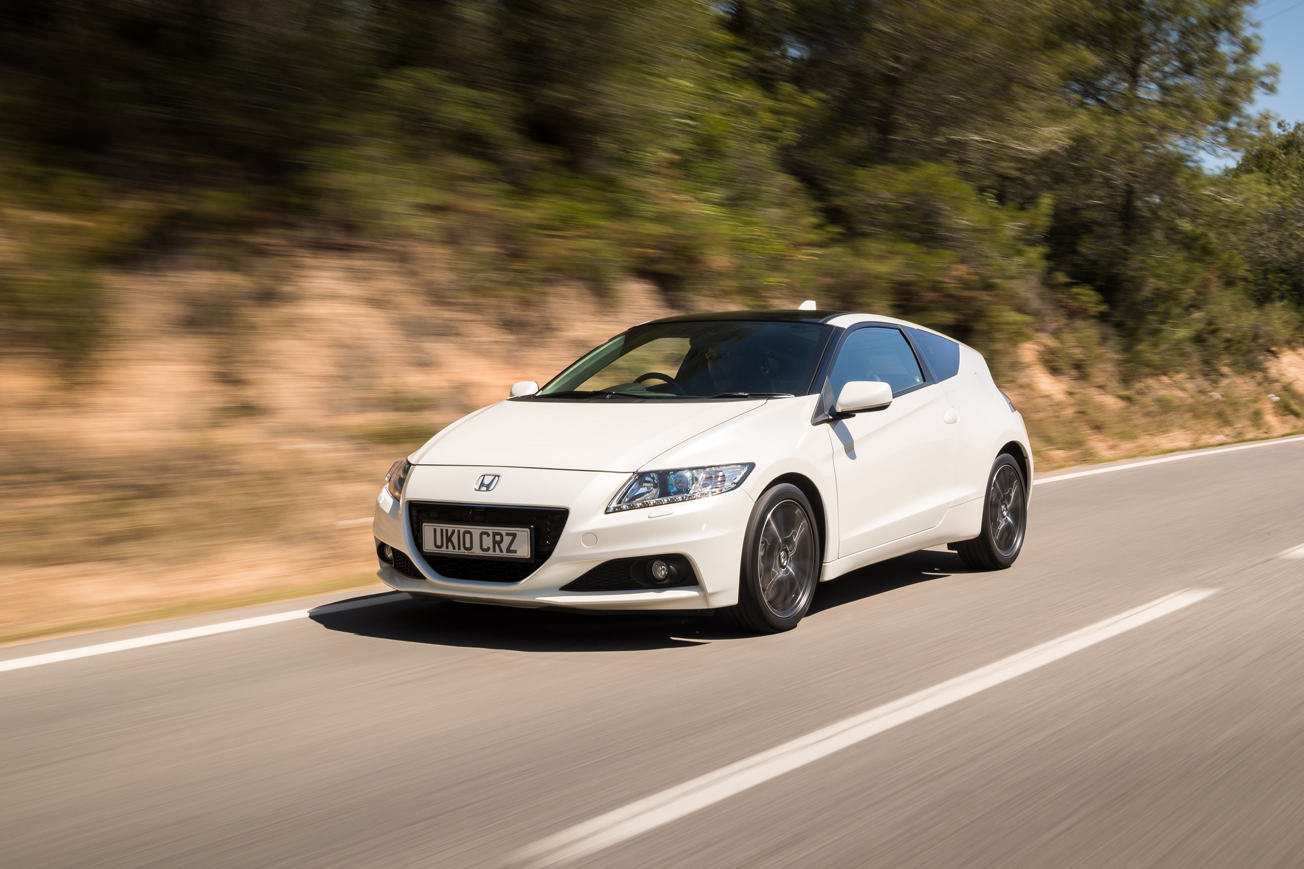 White Honda CR-Z driving
