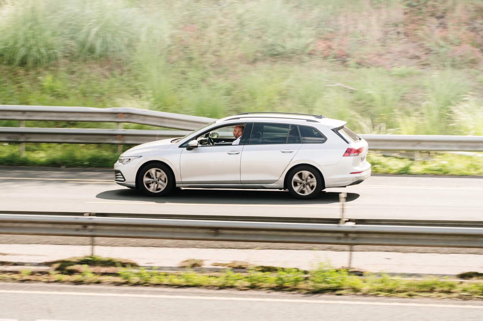 man driving car