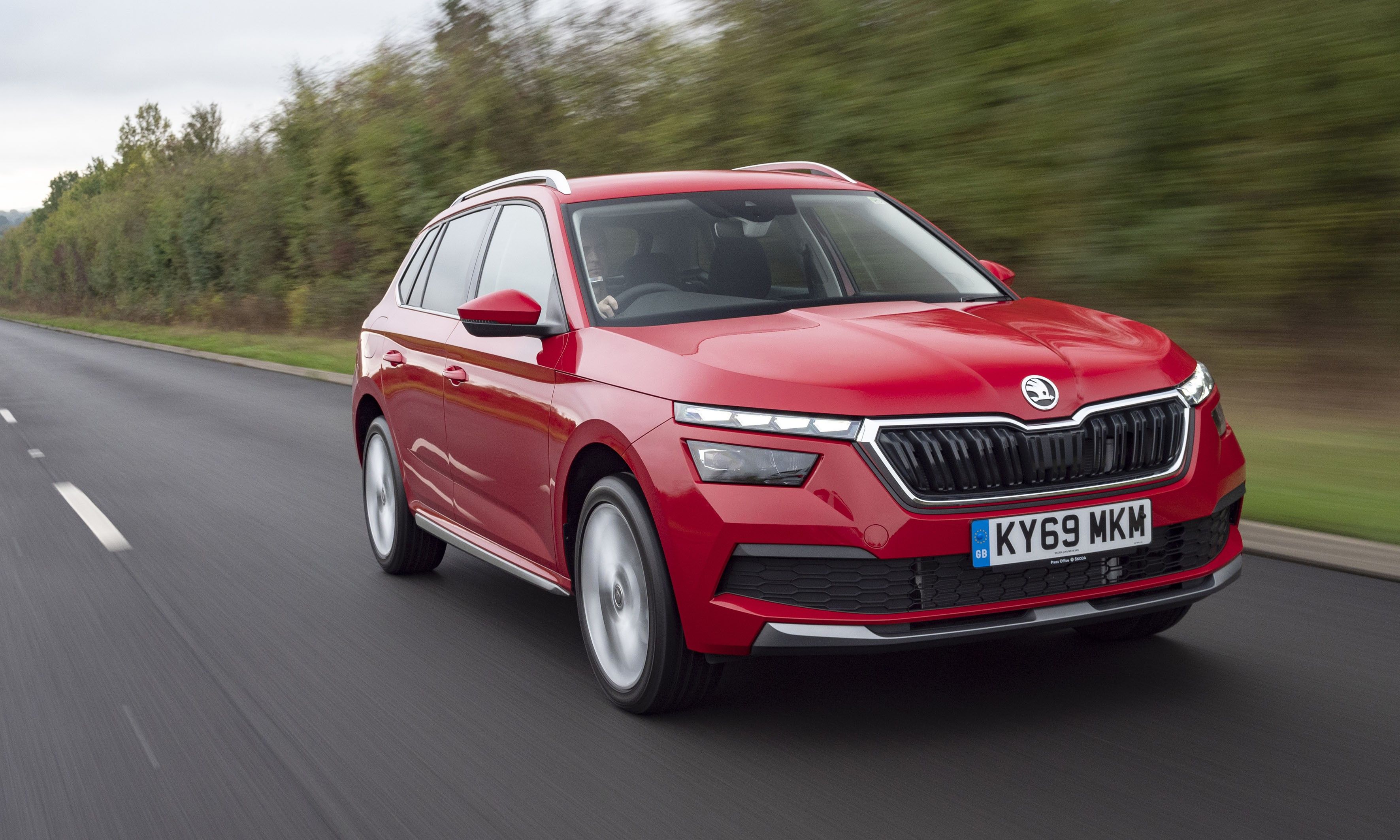 Red Skoda Kamiq driving
