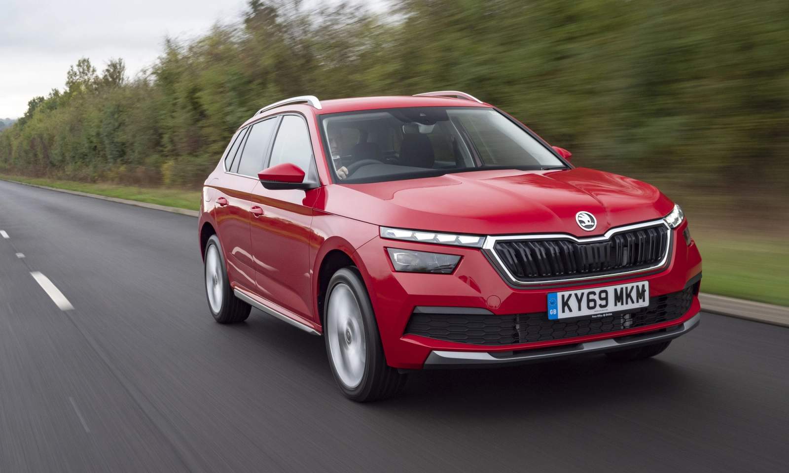 Red Skoda Kamiq driving