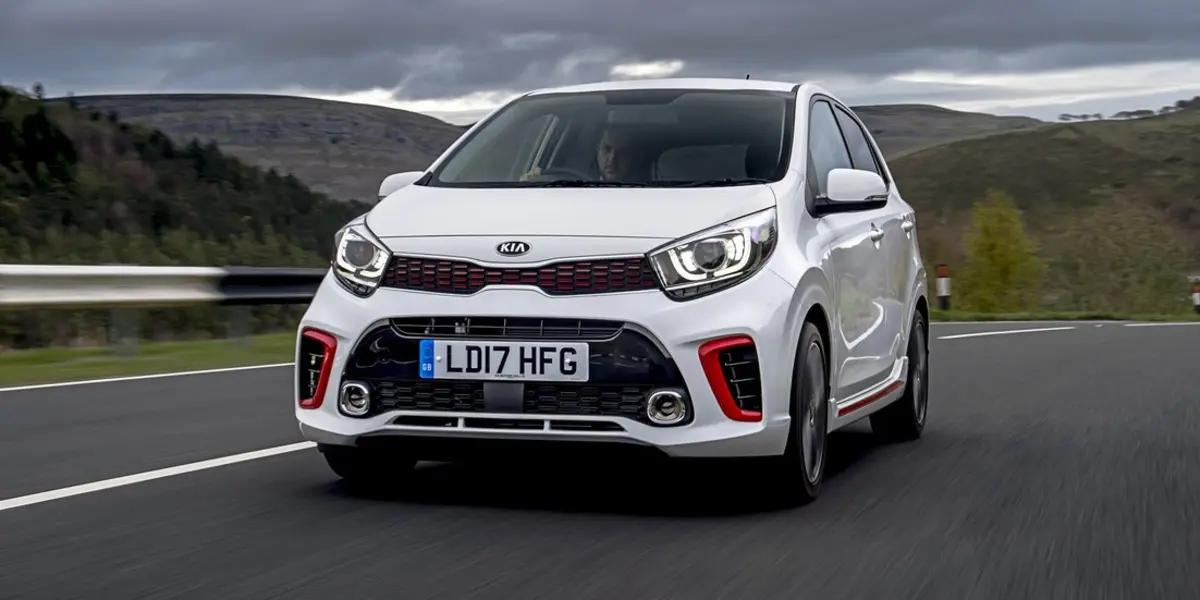 man driving white car