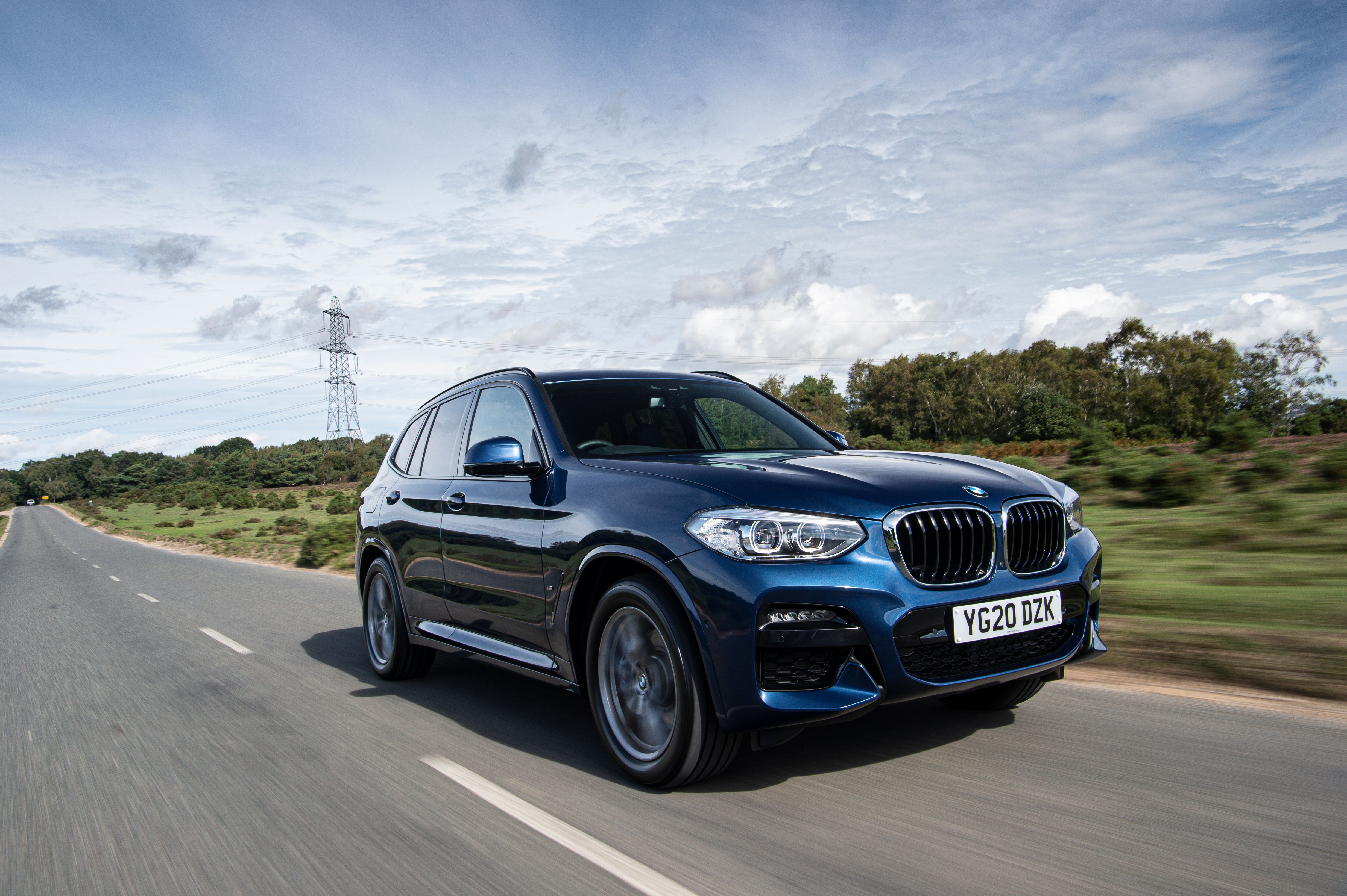 Blue BMW X5 driving
