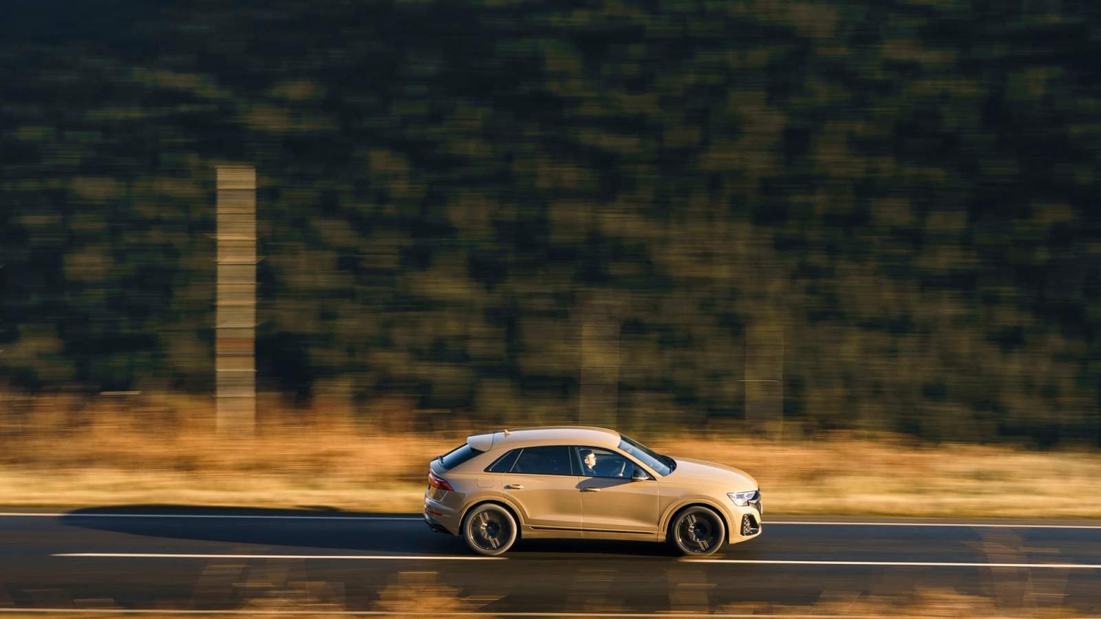 Beige Audi SQ8 side driving