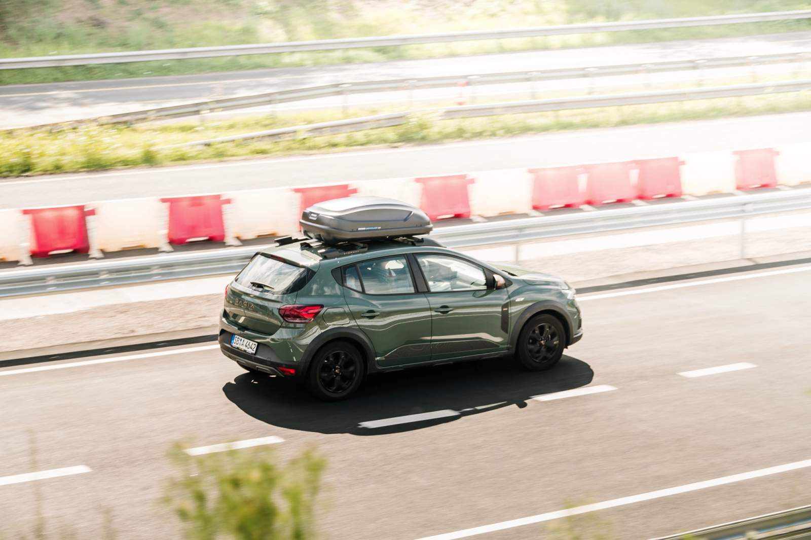 green car on the road