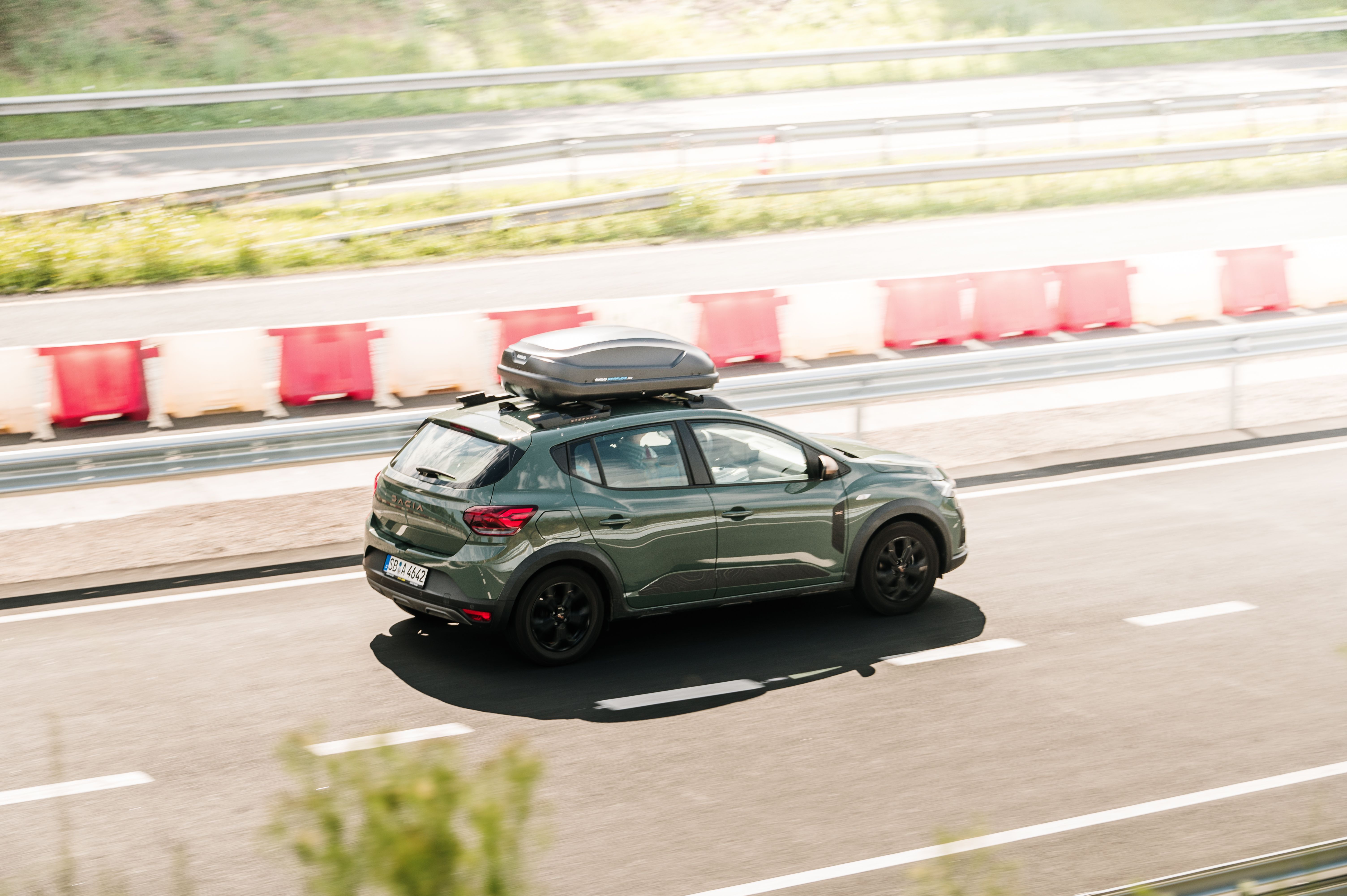 green car on the road