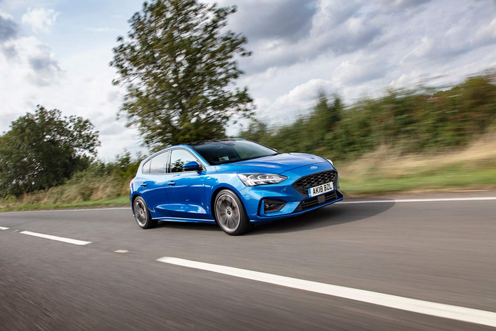 blue car on road 