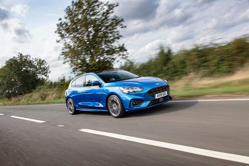 blue car on road