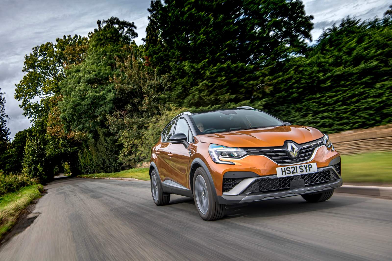 Gold Renault Captur driving