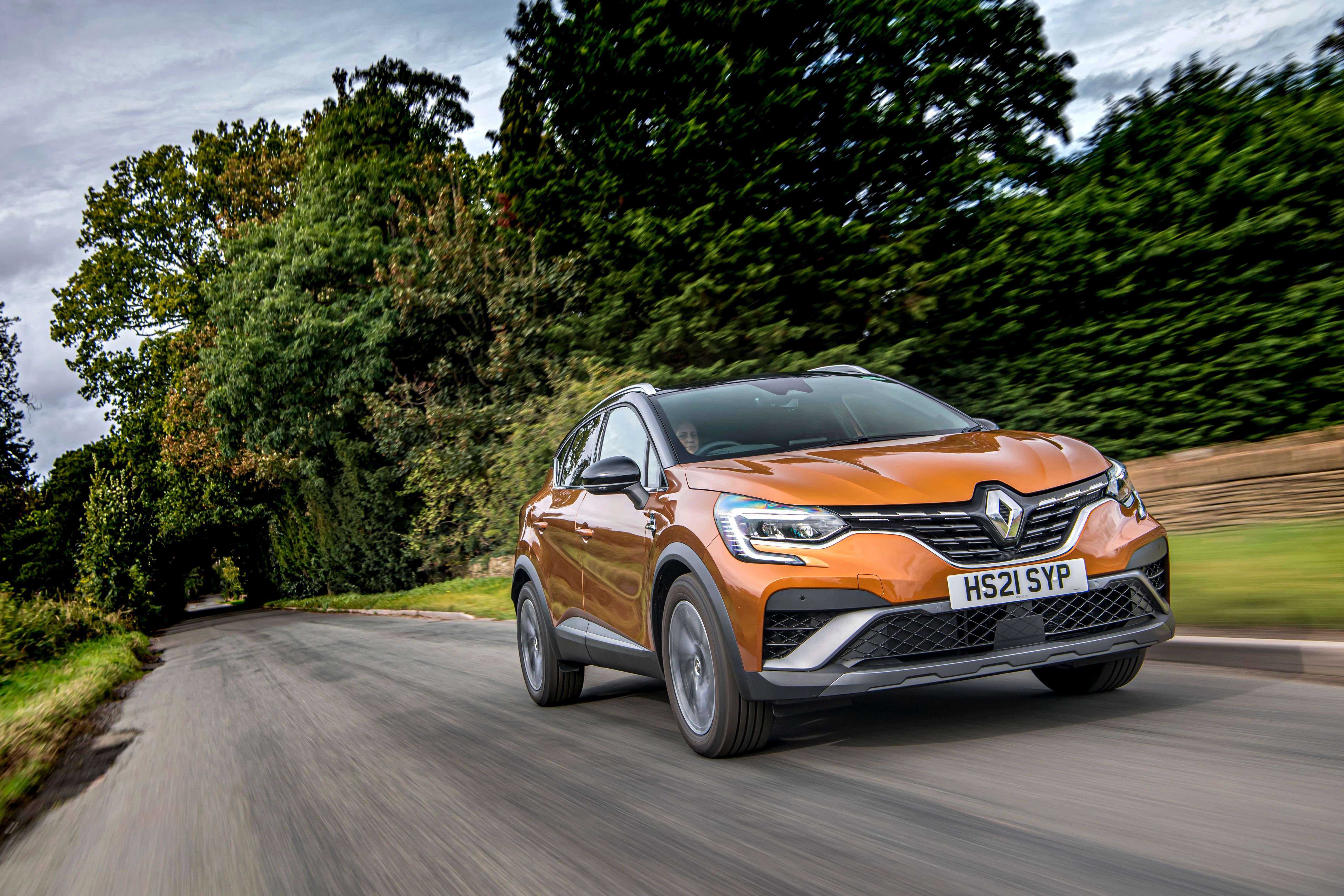 Gold Renault Captur driving