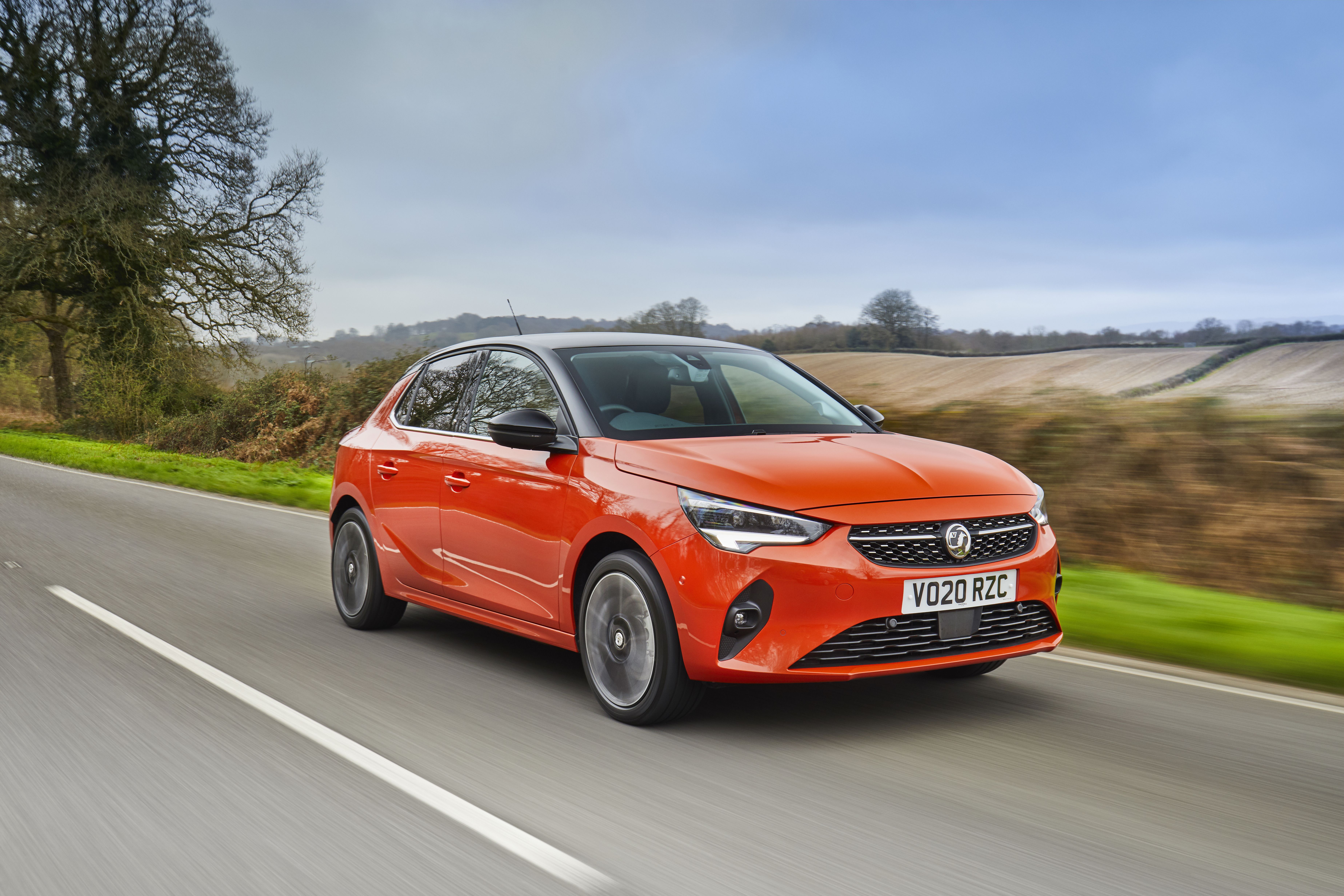 Orange Vauxhall Corsa-e driving