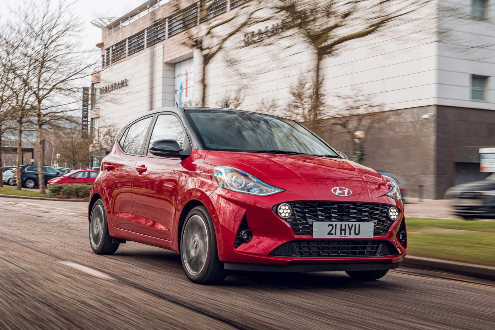 Red Hyundai i10 driving
